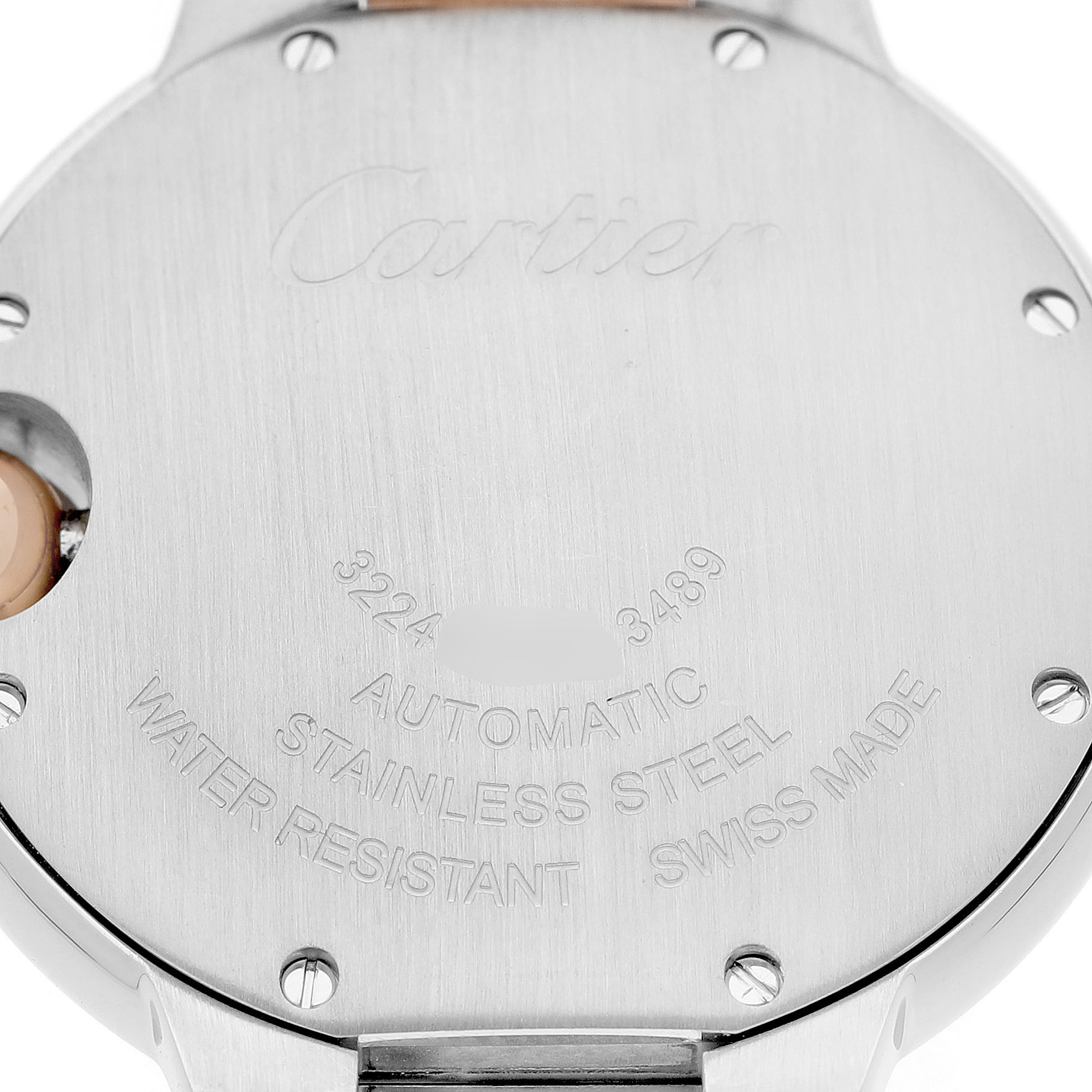 The image shows the back case of a Cartier Ballon Bleu WE902044 Women's Steel and Gold (two tone) Silver Dial watch, highlighting engravings and screws.