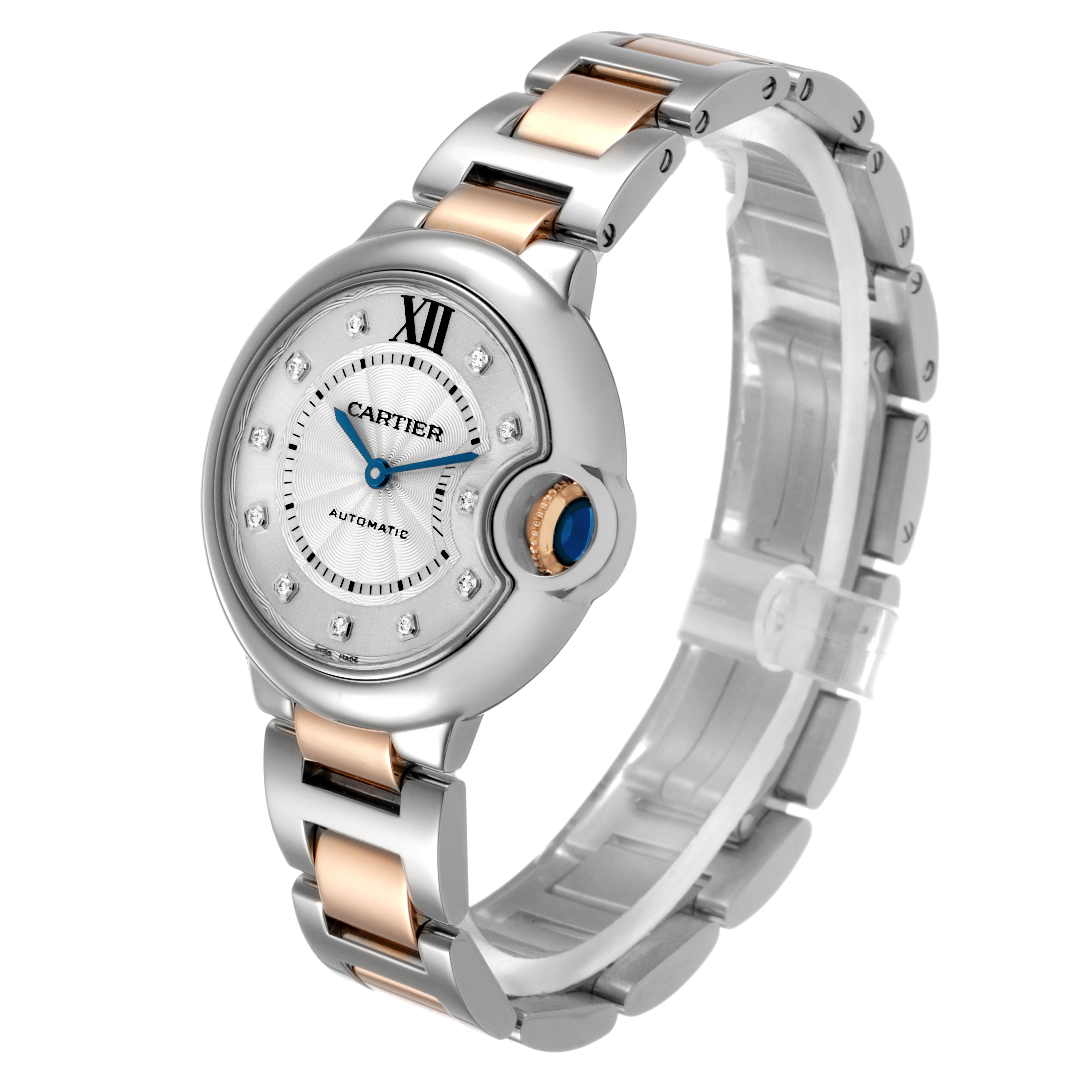 The Cartier Ballon Bleu WE902044 Women's Steel and Gold (two tone) Silver Dial watch is shown at a three-quarter angle, highlighting its face, crown, and bracelet.