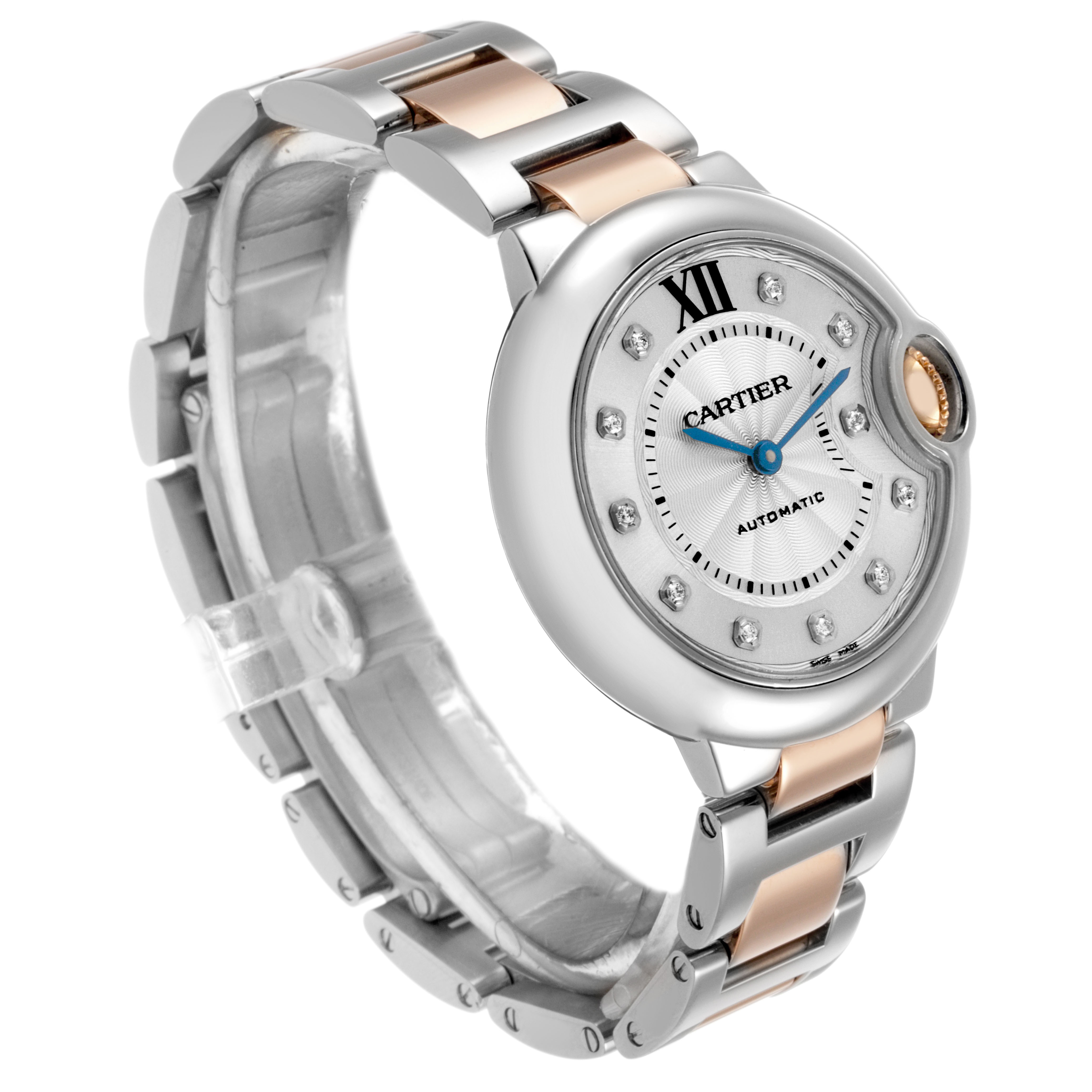 The Cartier Ballon Bleu WE902061 Women's Steel and Gold (two tone) Silver Dial watch is shown at a three-quarter angle, highlighting its round face, crown, and two-tone bracelet.