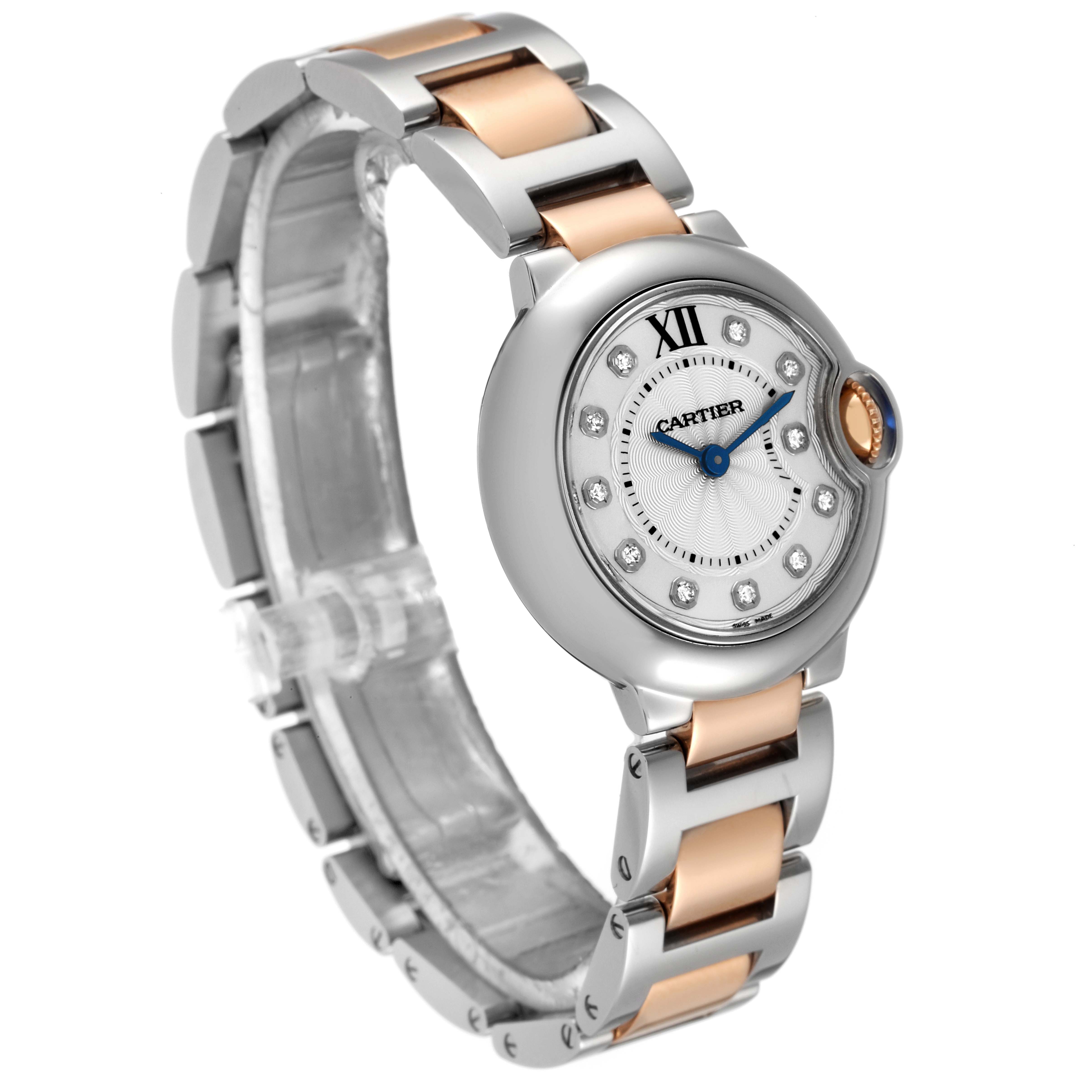 This is a Cartier Ballon Bleu WE902030 Women's Steel and Gold (two tone) Silver Dial WE902030 Women's Steel and Gold (two tone) Silver Dial watch shown at a slight angle, displaying the face, bezel, and metal bracelet.