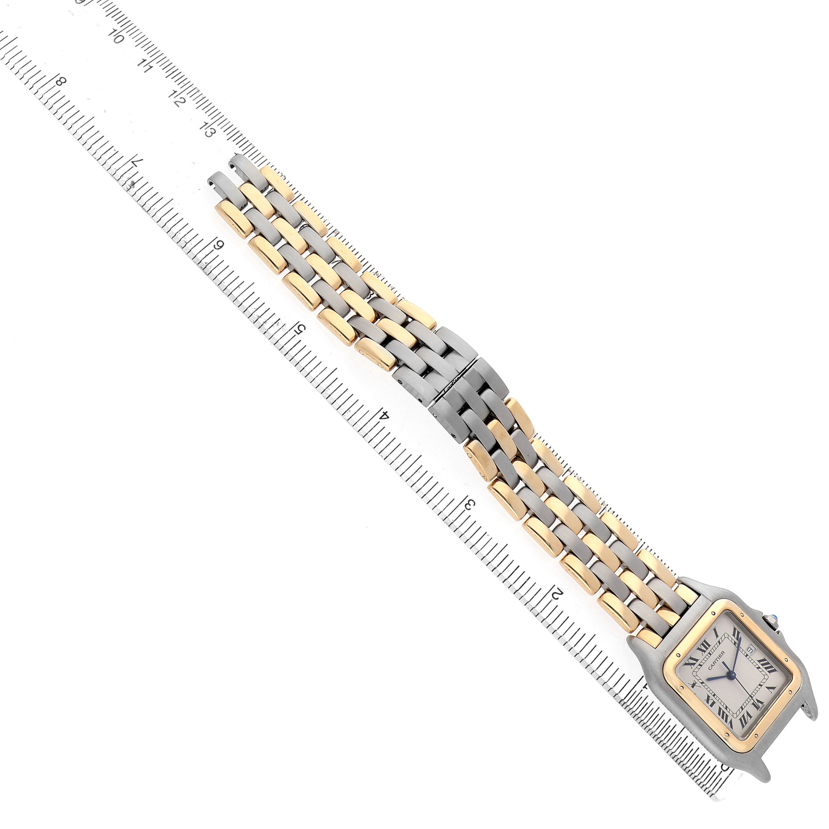 The Cartier Panthere 183957 Men's Steel and Gold (two tone) Silver Dial watch is displayed flat, showing its dual-tone bracelet and square face, alongside a ruler for scale.
