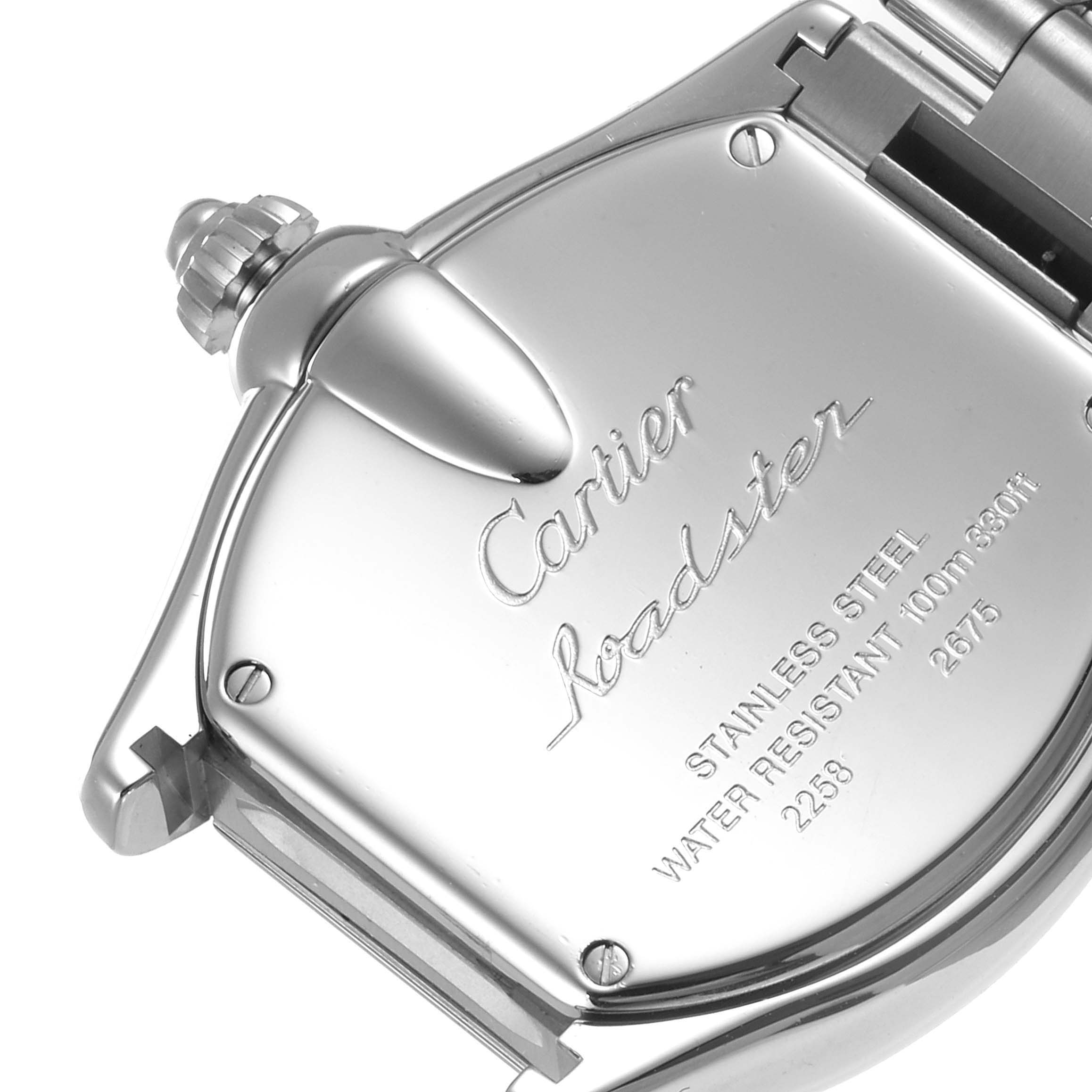 This image shows the back case and crown of a Cartier Roadster W62017V3 Women's Stainless Steel Pink Dial W62017V3 Women's Stainless Steel Pink Dial watch from a close-up angle.