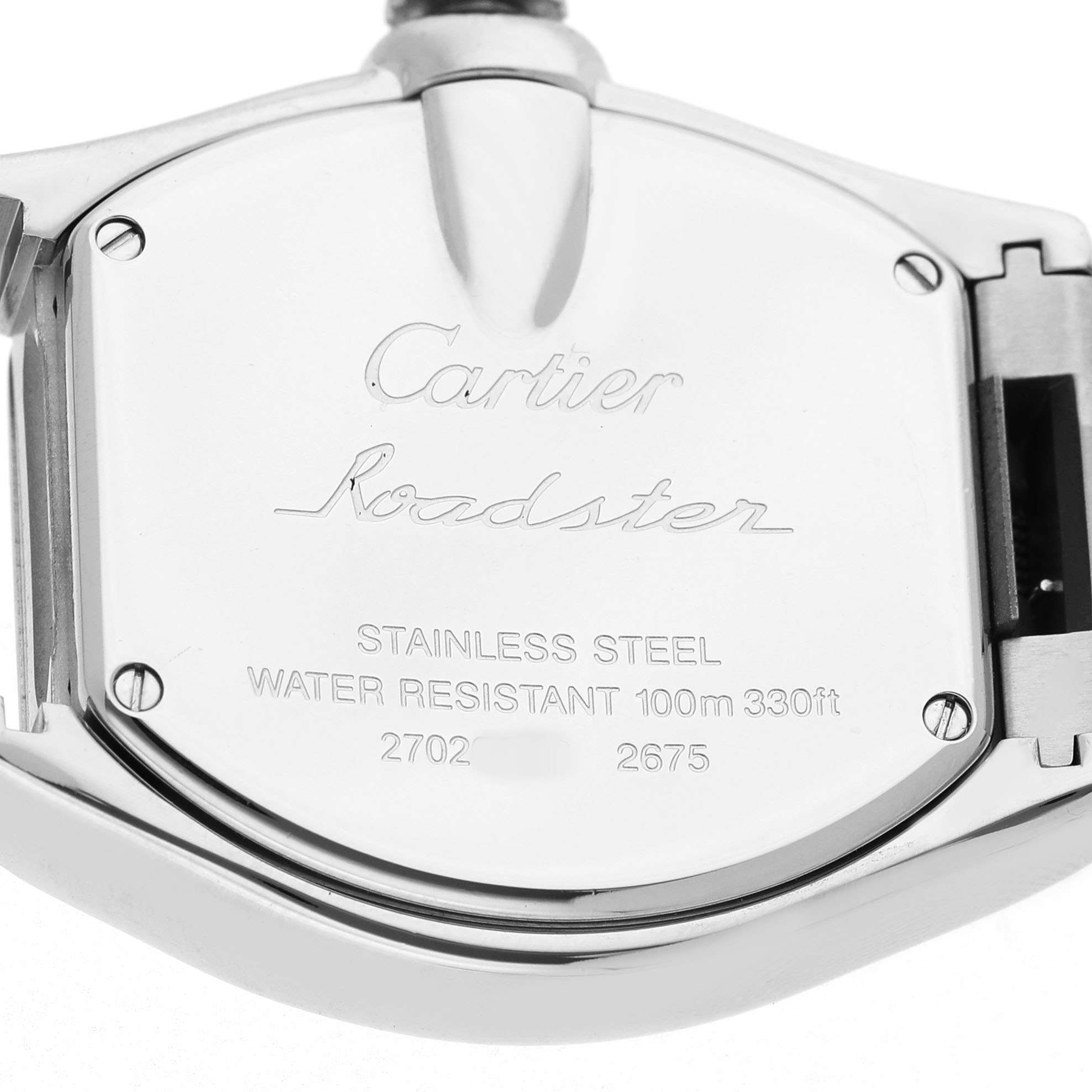 The image shows the back case of a Cartier Roadster W62017V3 Women's Stainless Steel Pink Dial watch with engravings of the model details.