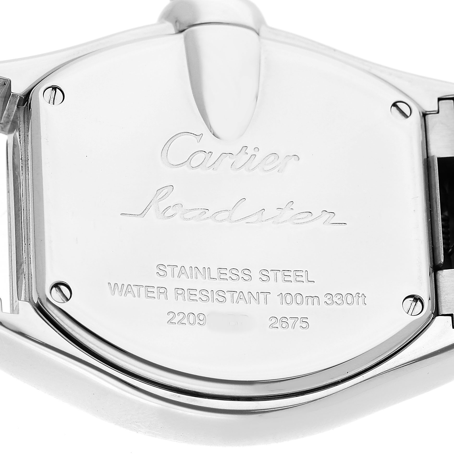 The image shows the back of a Cartier Roadster W62016V3 Women's Stainless Steel Silver Dial watch, highlighting the engraved details.
