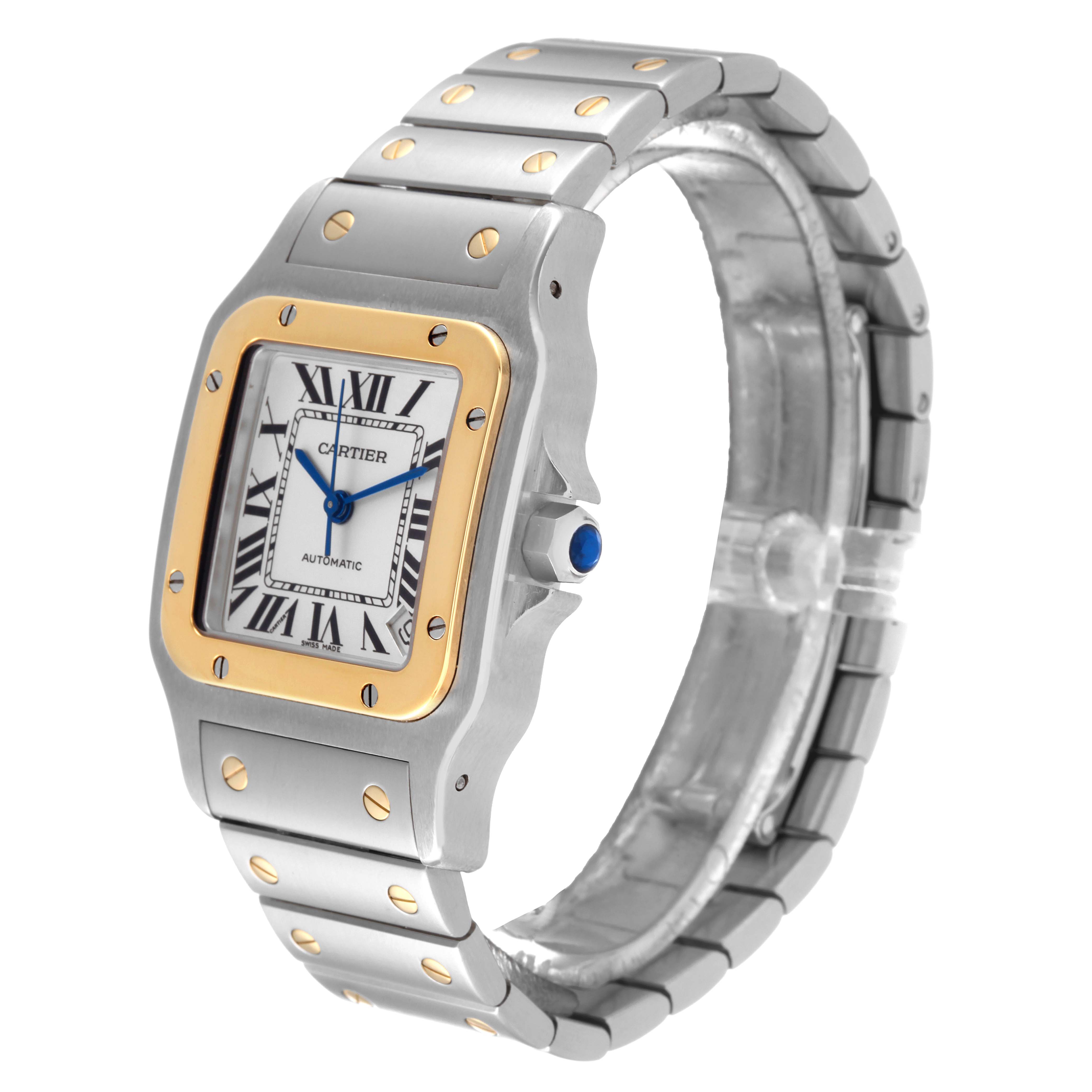 The image shows a Cartier Santos W20099C4 Men
s Steel and Gold (two tone) Silver Dial W20099C4 Men
s Steel and Gold (two tone) Silver Dial watch from a front-angle perspective, highlighting its dial, bezel, and bracelet.