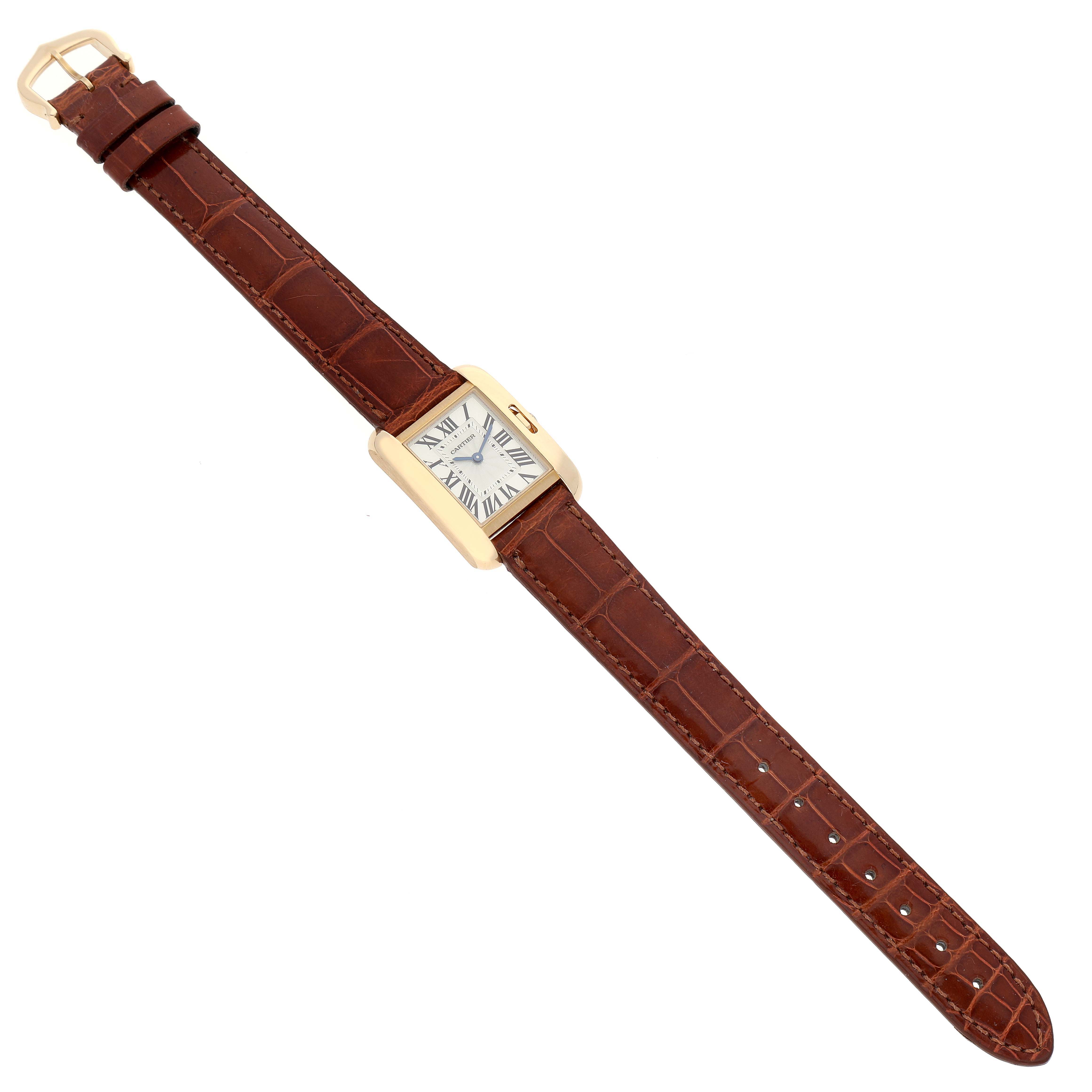 The image shows an overhead view of a Cartier Tank Anglaise W5310028 Women's Yellow Gold Silver Dial W5310028 Women's Yellow Gold Silver Dial watch, featuring the face, case, and entire brown leather strap.
