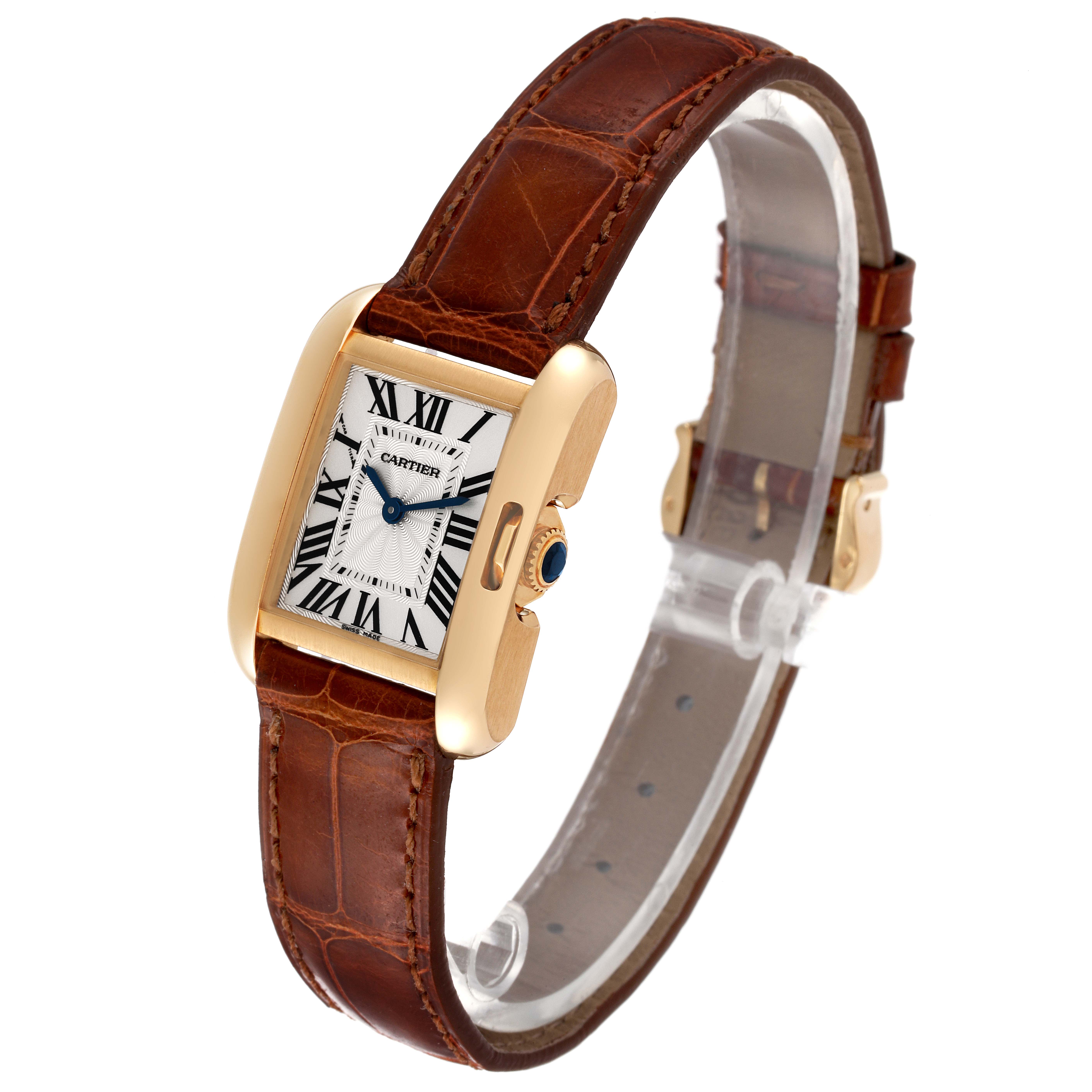 The Cartier Tank Anglaise W5310028 Women's Yellow Gold Silver Dial W5310028 Women's Yellow Gold Silver Dial watch is shown at a slight angle, displaying its gold case, leather strap, and Roman numeral dial.