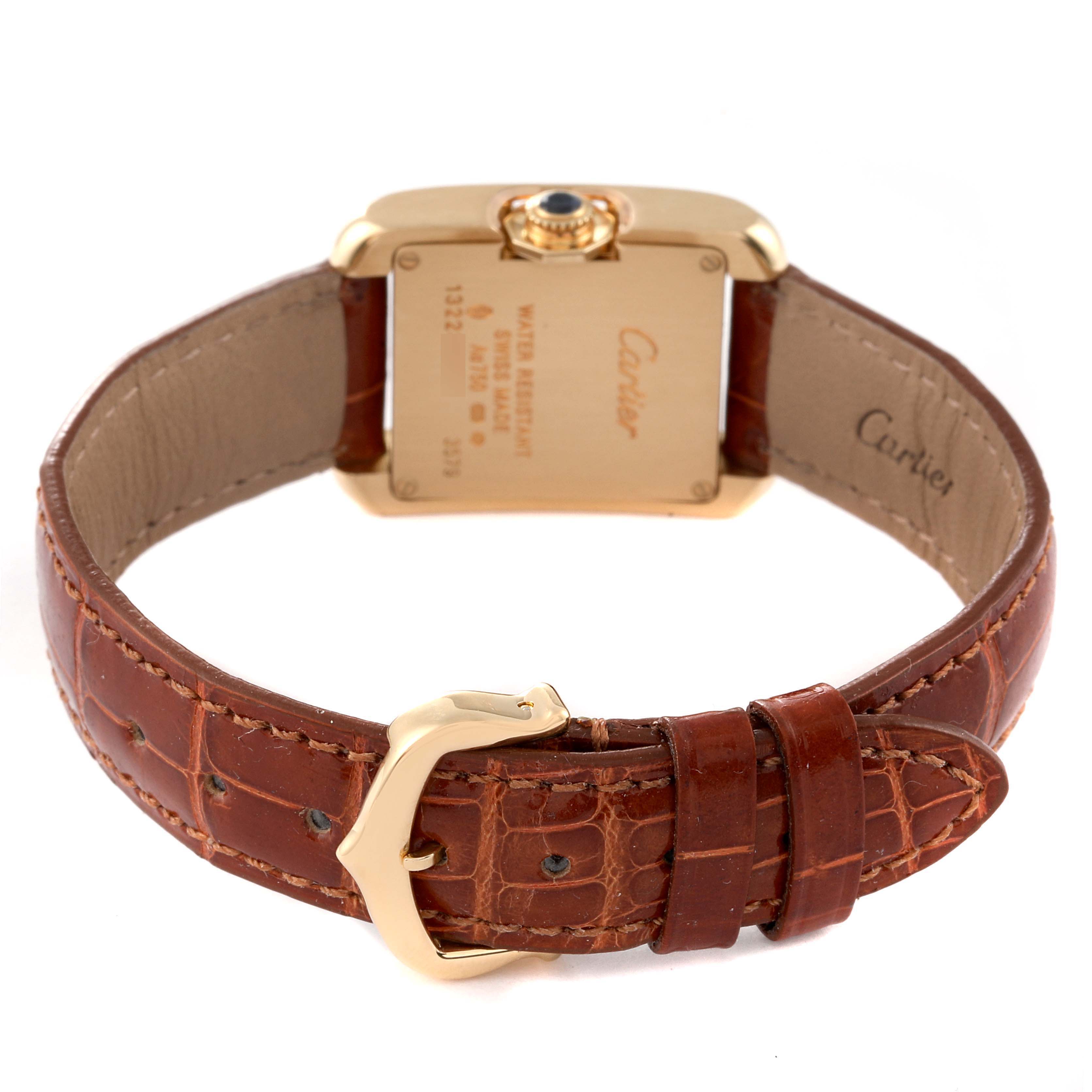 The image shows the back side and the brown leather strap of the Cartier Tank Anglaise W5310028 Women's Yellow Gold Silver Dial W5310028 Women's Yellow Gold Silver Dial watch.