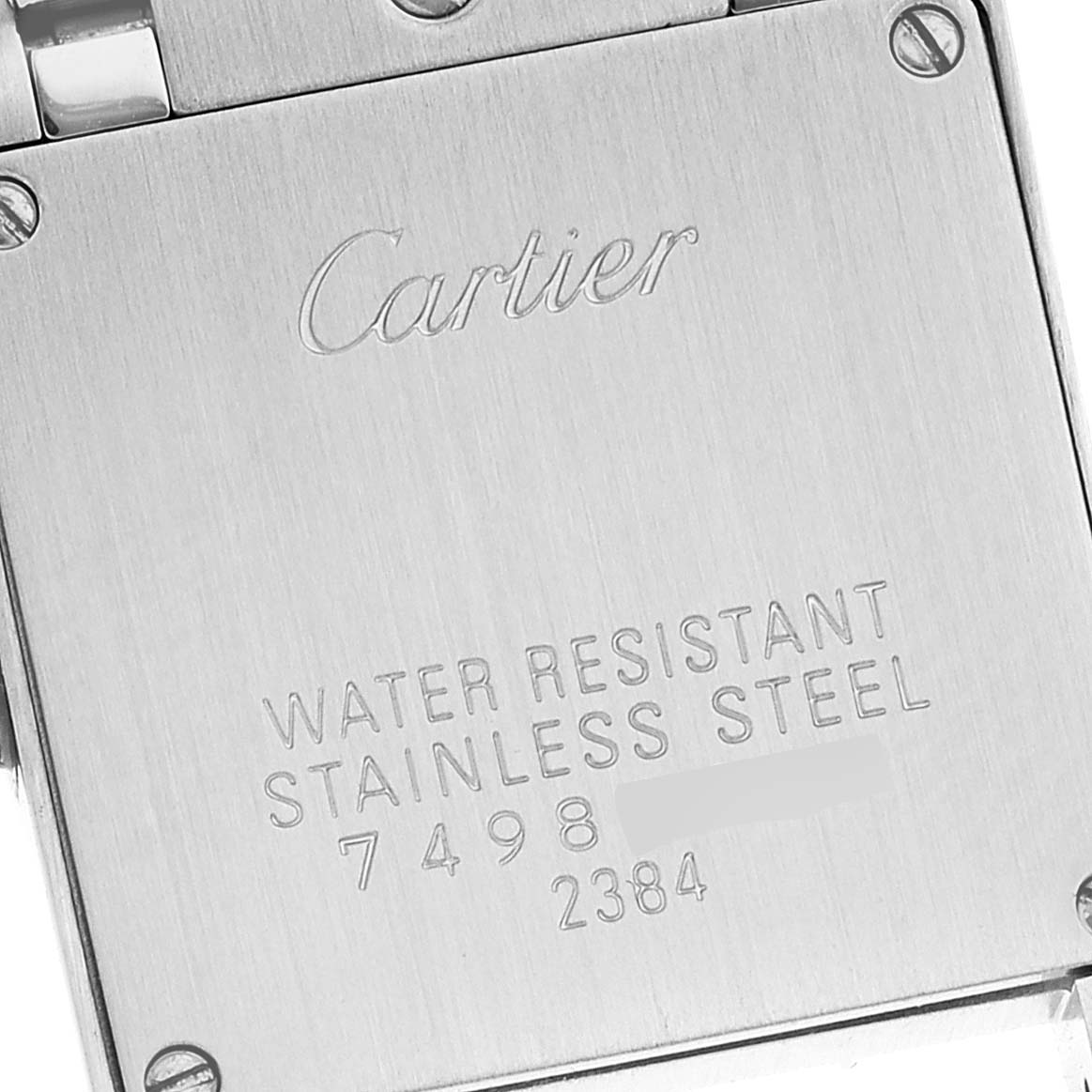 This image shows the case back of a Cartier Tank Française watch, highlighting its water resistance and stainless steel material.