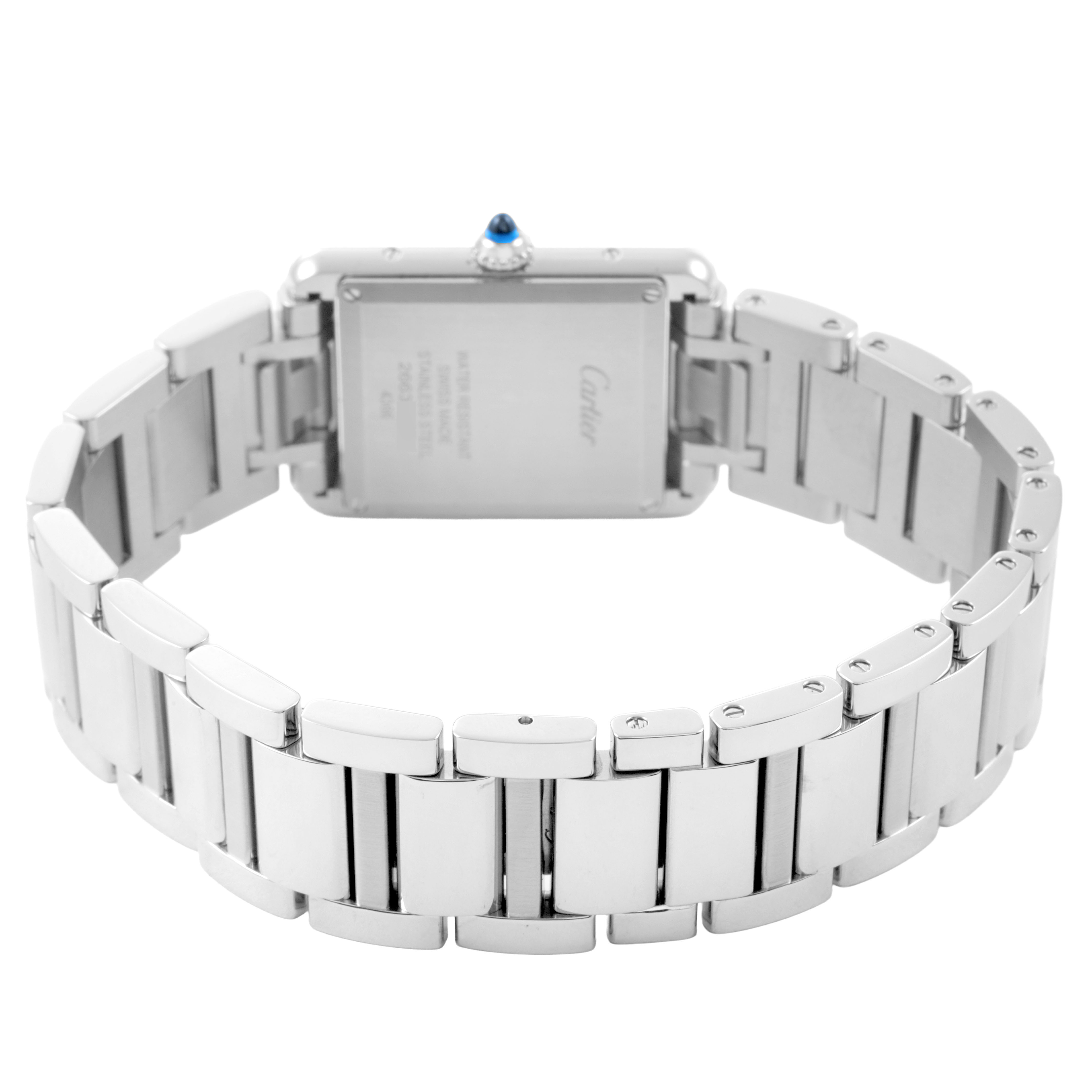 The image shows the back of the Cartier Tank Must WSTA0062 Women's Stainless Steel Silver Dial watch with a metal bracelet and visible crown.