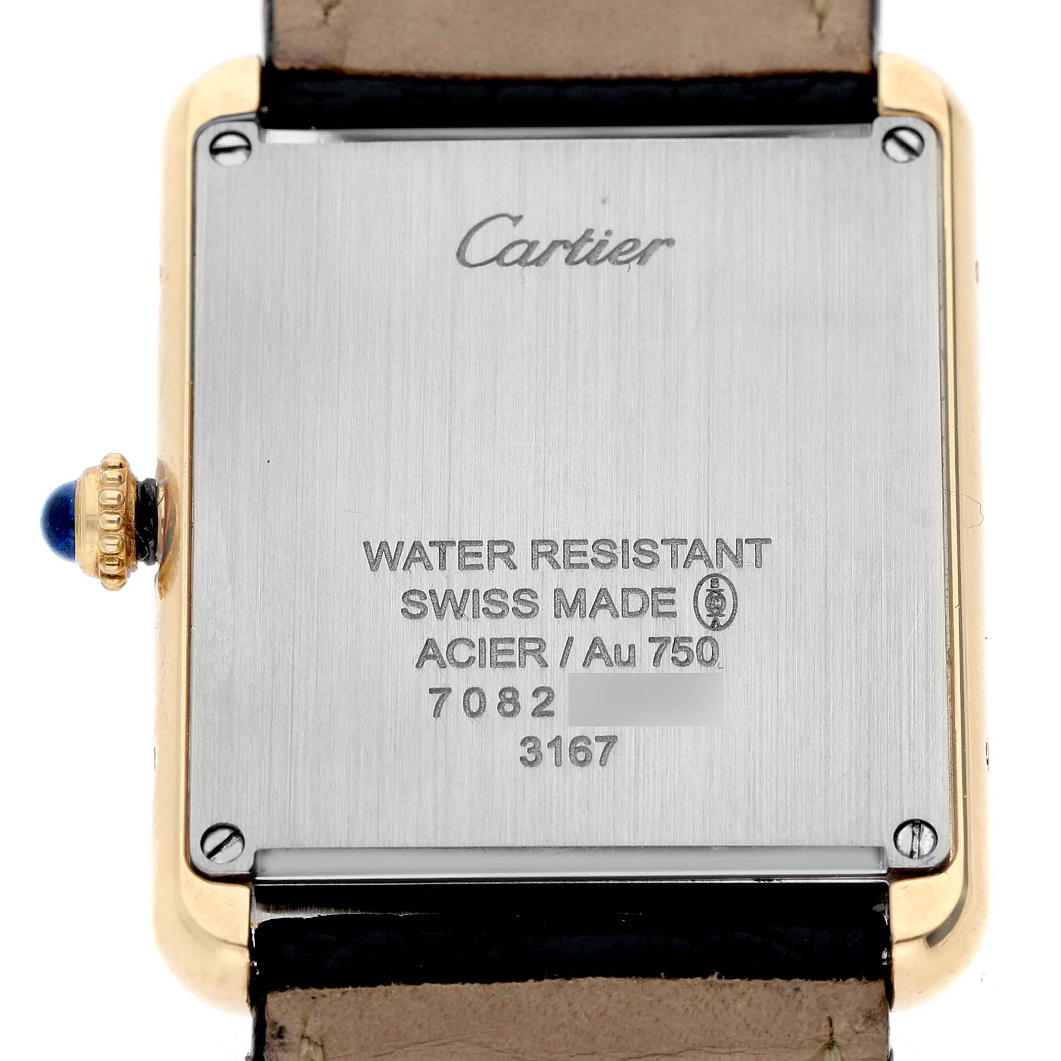 The image shows the back of a Cartier Tank Solo W5200004 Men's Yellow Gold Silver Dial watch, detailing engravings and the crown with a blue cabochon.