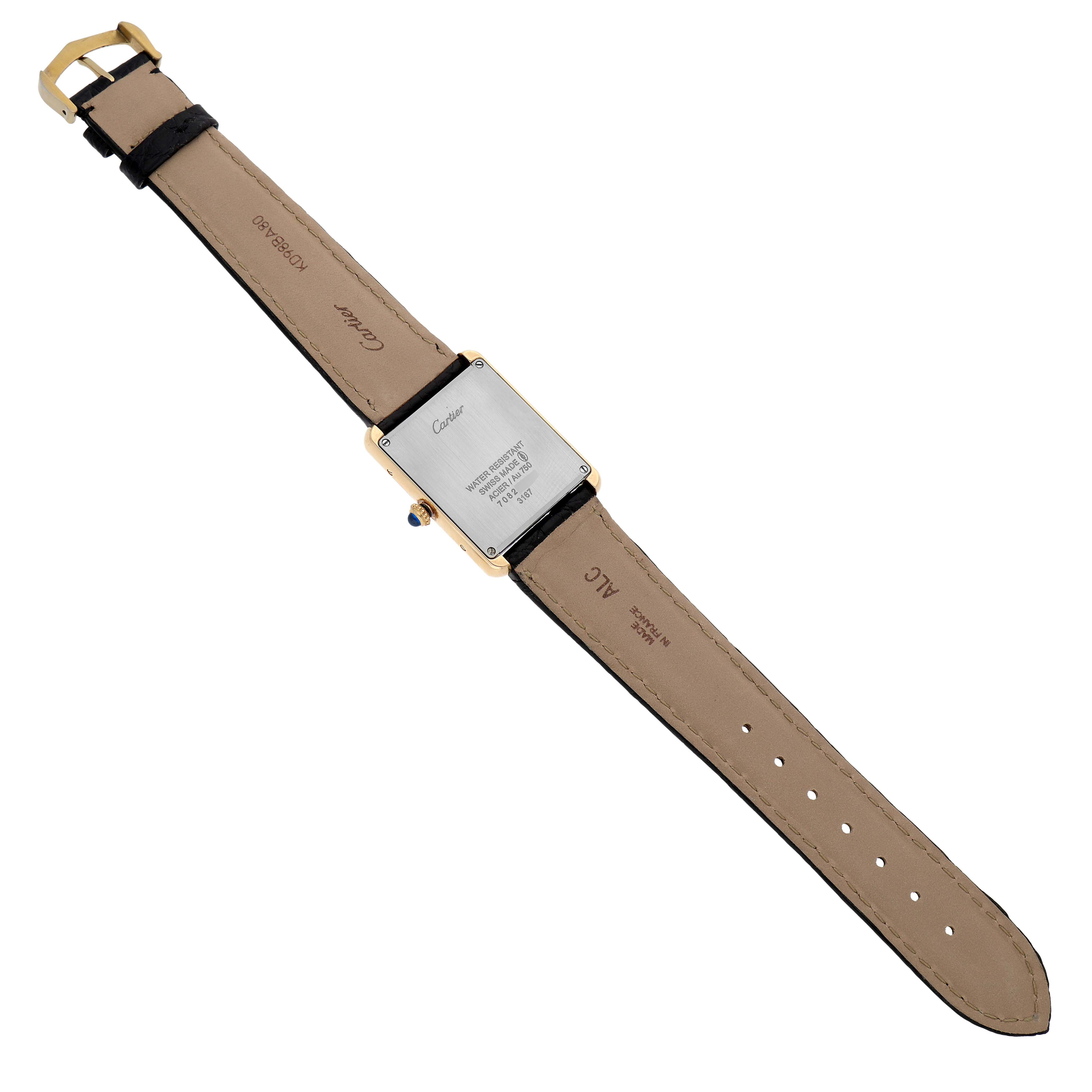The image shows the back view of a Cartier Tank Solo W5200004 Men's Yellow Gold Silver Dial watch, highlighting the case back and leather strap.