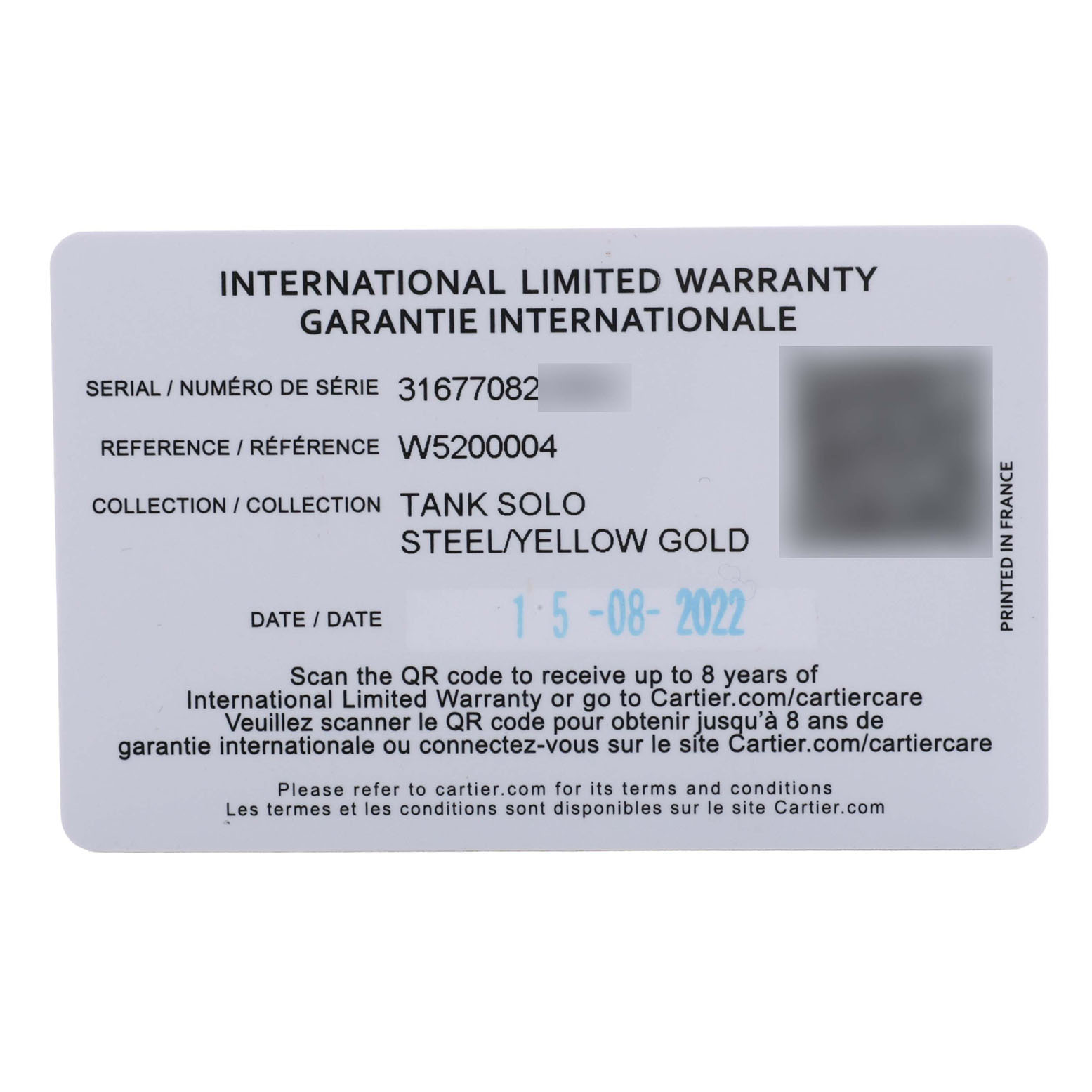 This image shows the international limited warranty card for the Cartier Tank Solo W5200004 Men's Yellow Gold Silver Dial watch, in steel and yellow gold.