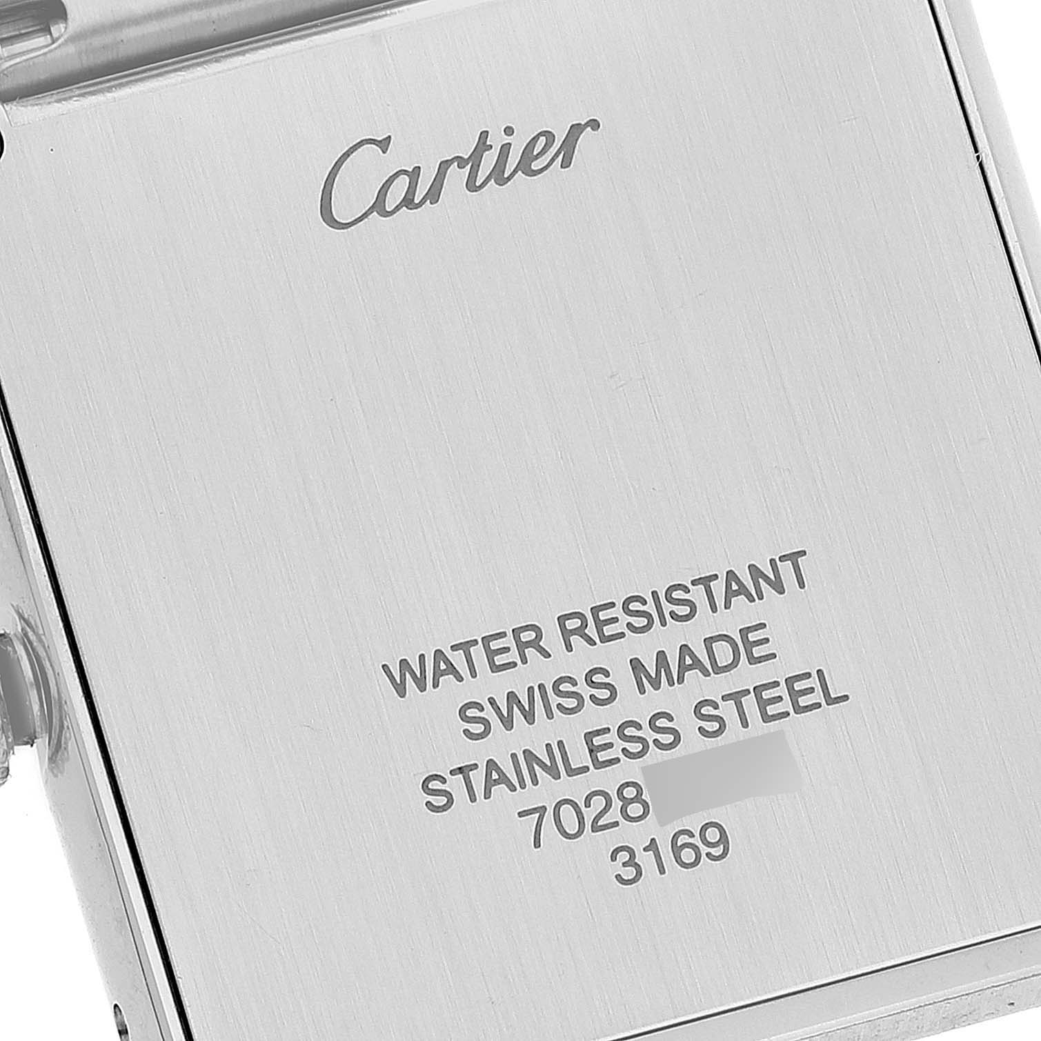 The image shows the back case of the Cartier Tank Solo W5200014 Men's Stainless Steel Silver Dial W5200014 Men's Stainless Steel Silver Dial watch, highlighting its inscriptions and material details.