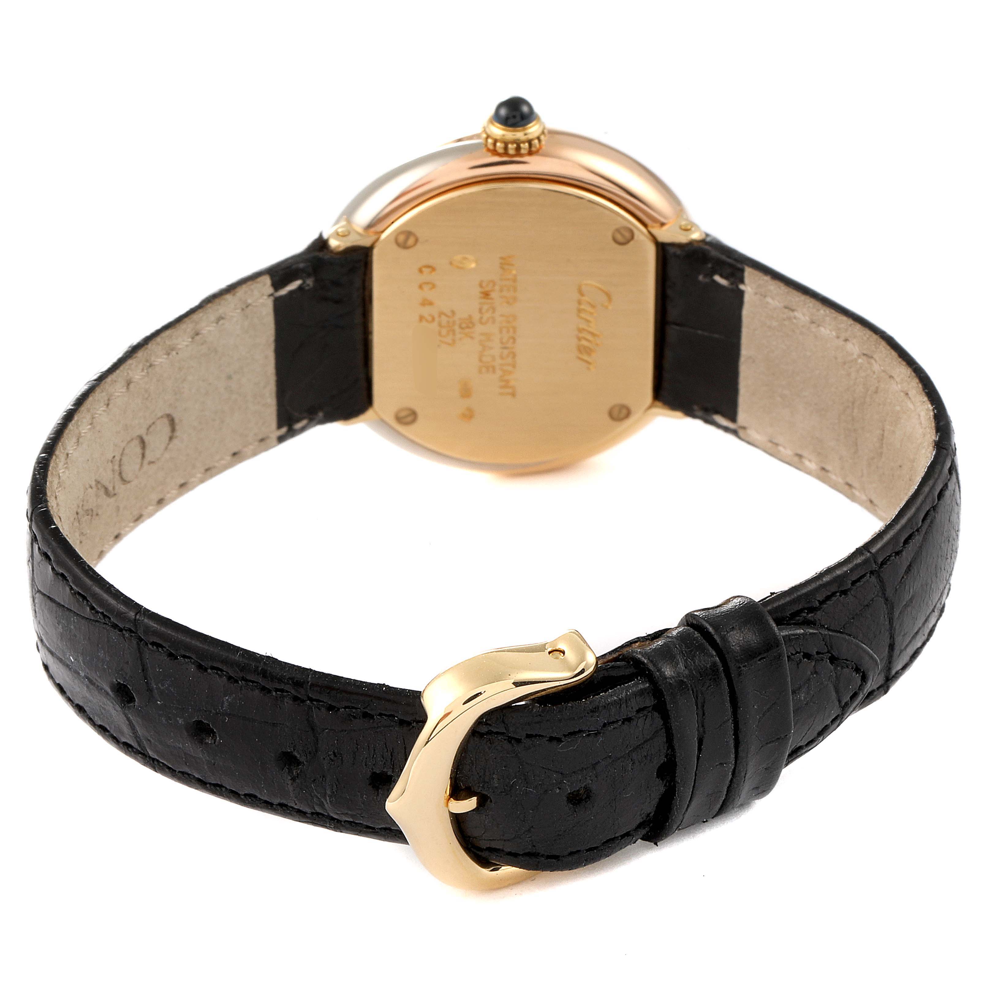 This image shows the back view of the Cartier Trinity 2357 Women's Yellow Gold Silver Dial 2357 Women's Yellow Gold Silver Dial watch, displaying its case back, leather strap, and buckle.