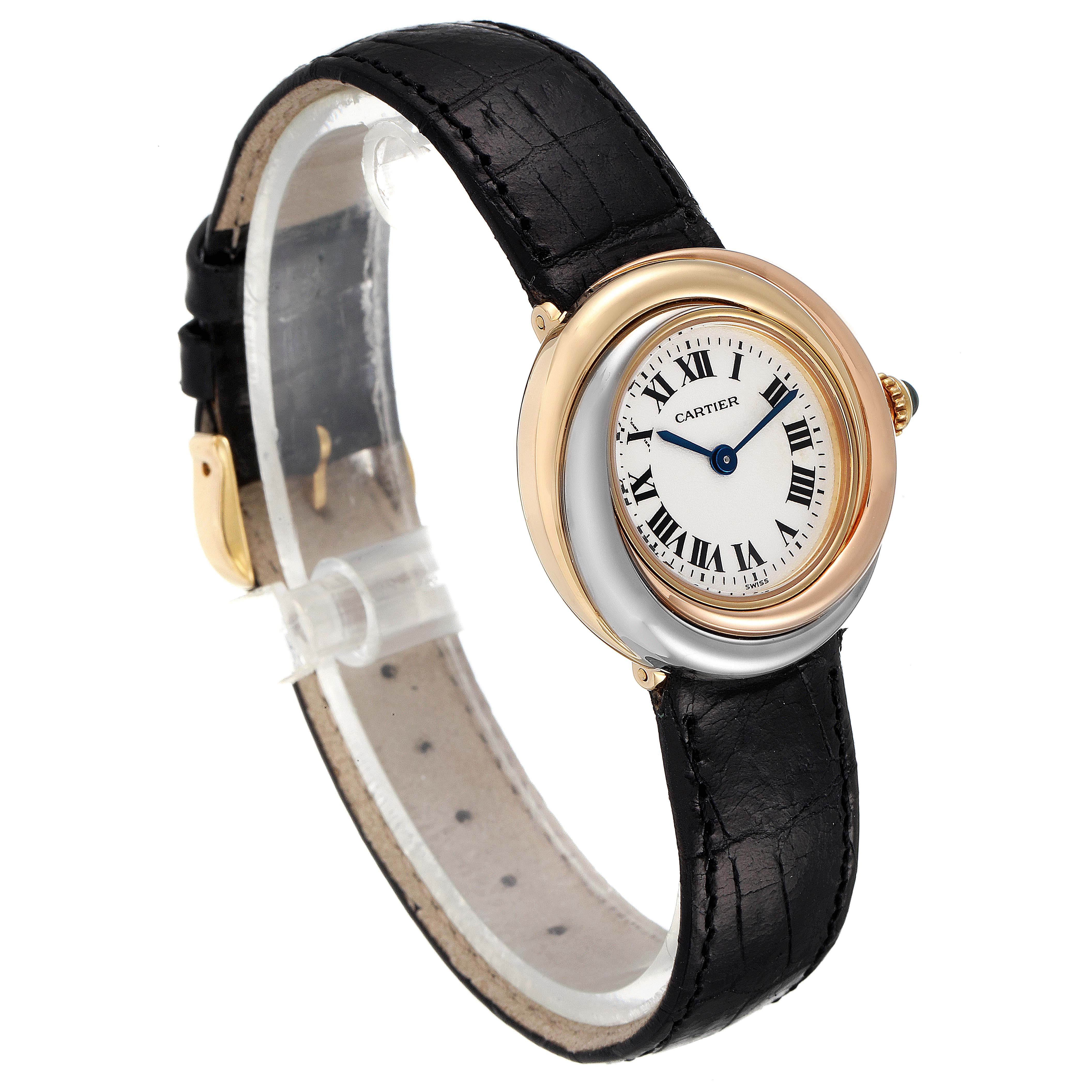 The Cartier Trinity 2357 Women's Yellow Gold Silver Dial 2357 Women's Yellow Gold Silver Dial model watch is shown at a three-quarter angle, displaying its black leather strap, round bezel, and white dial with Roman numerals.