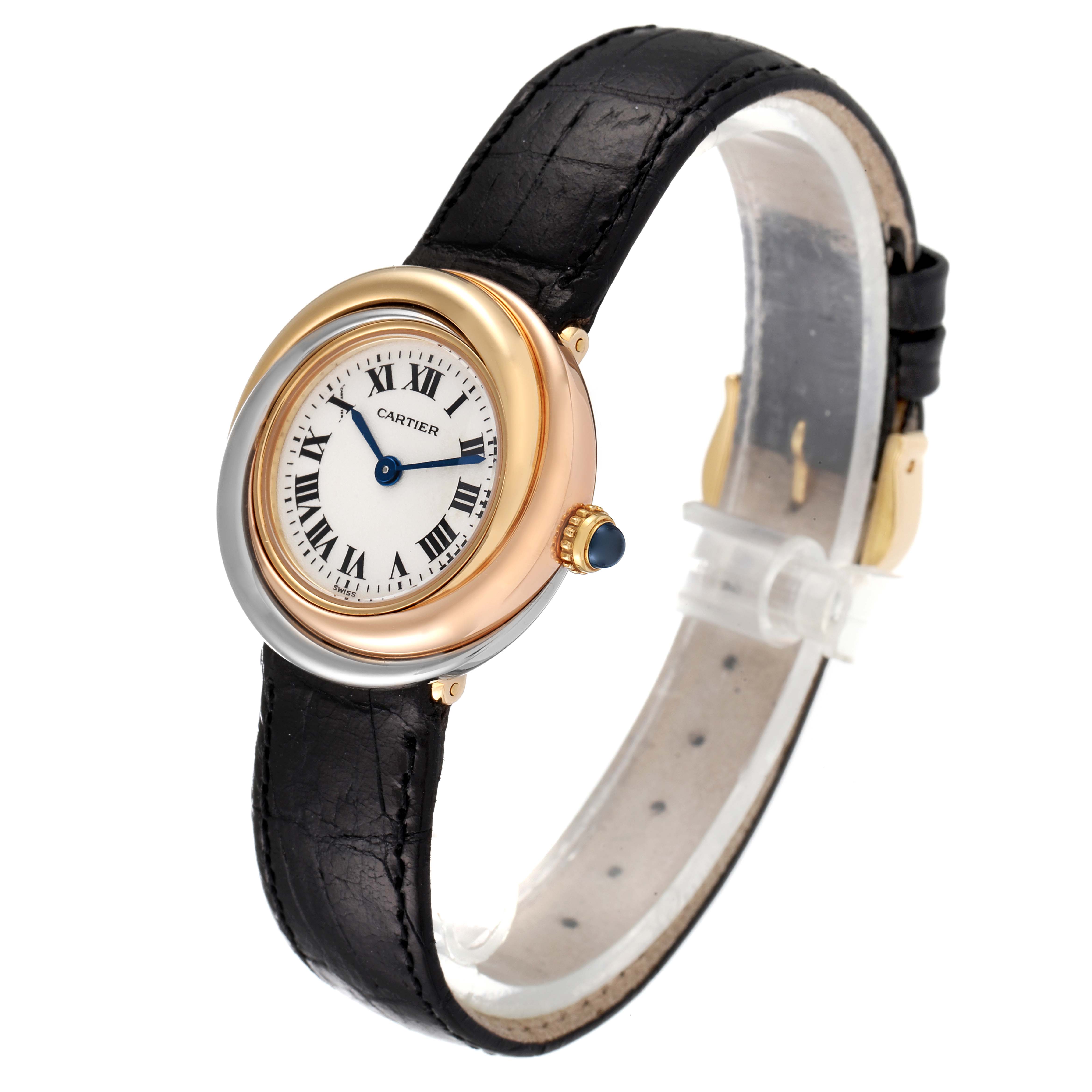 The Cartier Trinity 2357 Women's Yellow Gold Silver Dial 2357 Women's Yellow Gold Silver Dial watch is shown angled towards the left, displaying its round face, Roman numerals, and black leather strap.