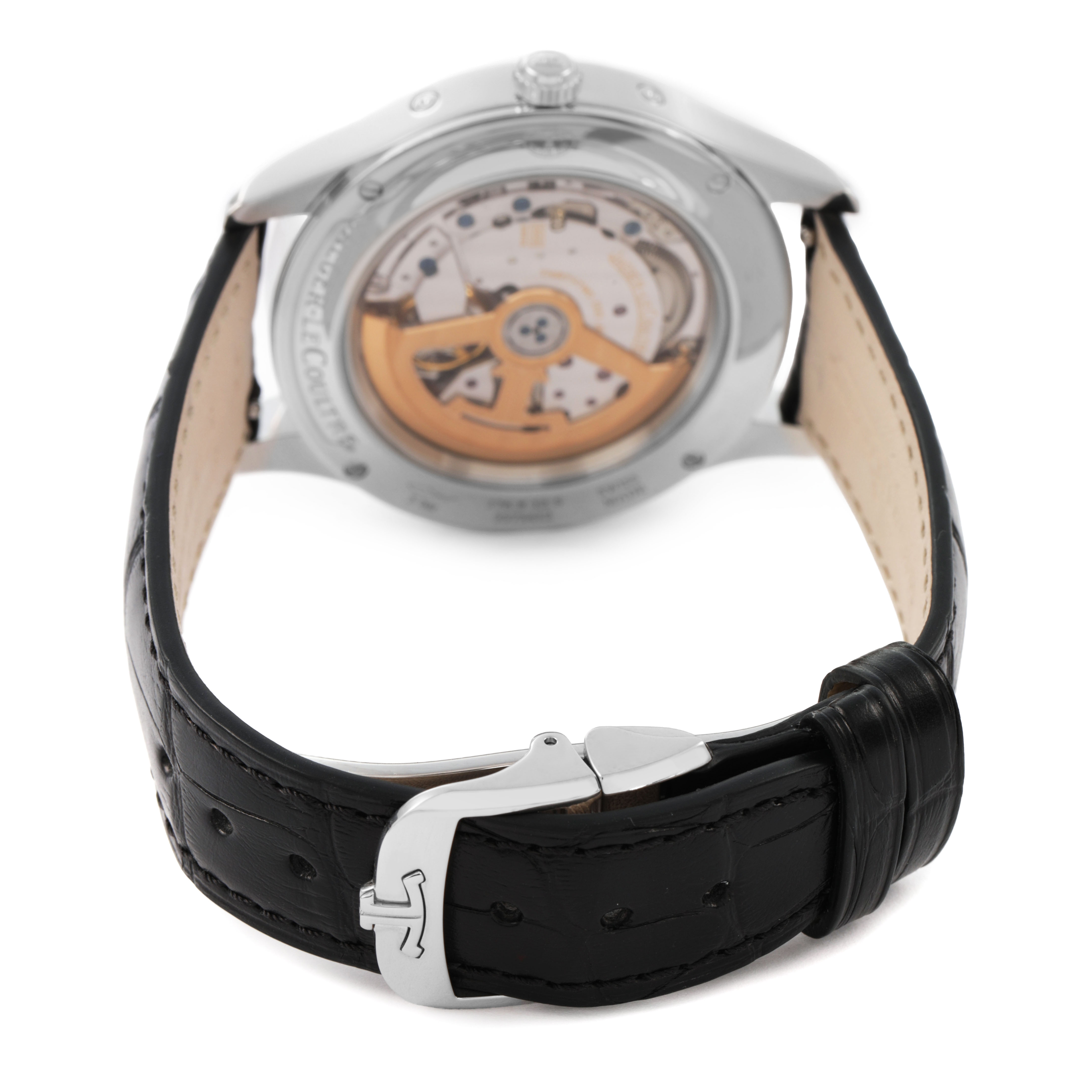The image shows a Jaeger-LeCoultre Master model watch from the back, highlighting the exposed movement and leather strap.