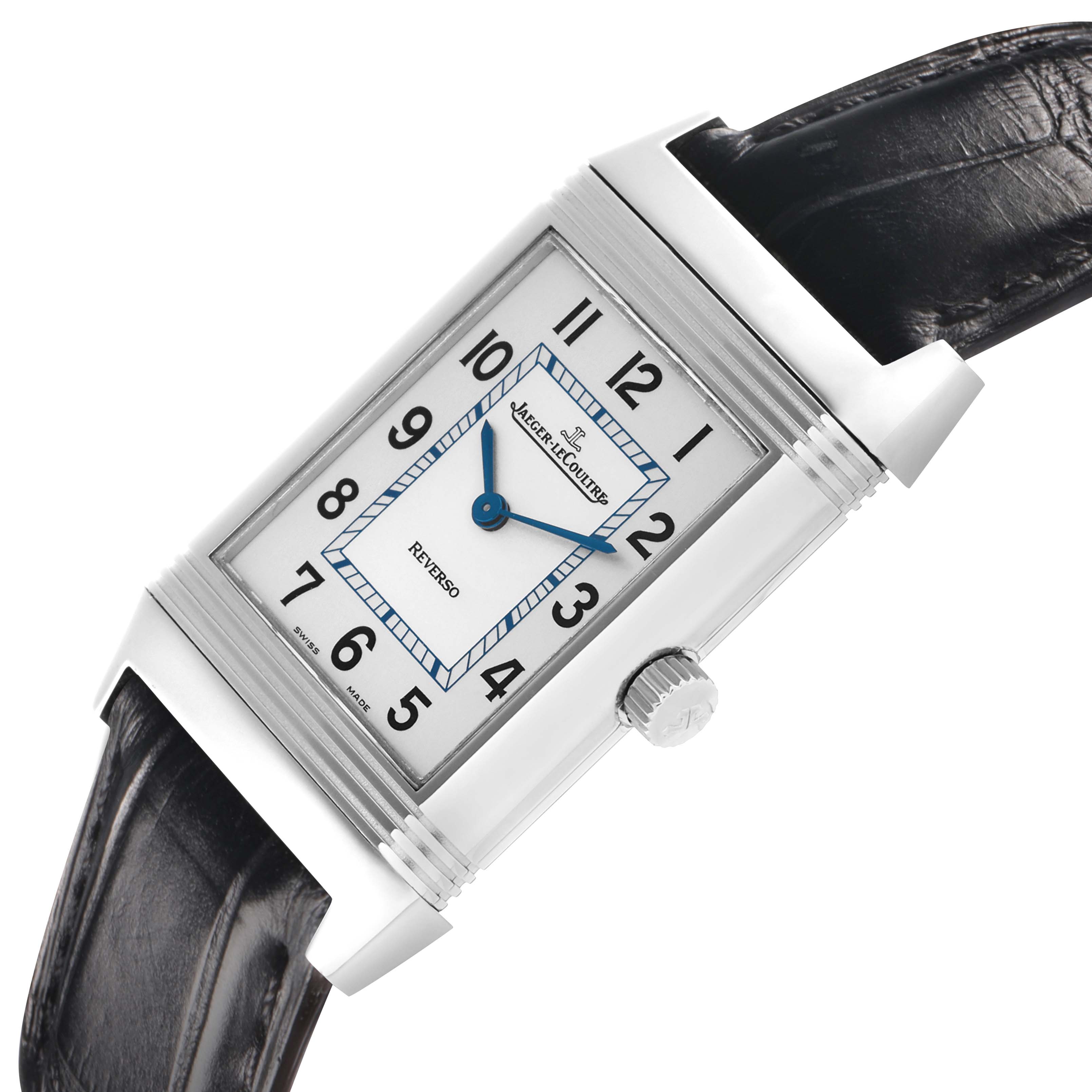 The Jaeger-LeCoultre Reverso watch is shown at an angled top view, highlighting its silver case, black leather strap, and crown.