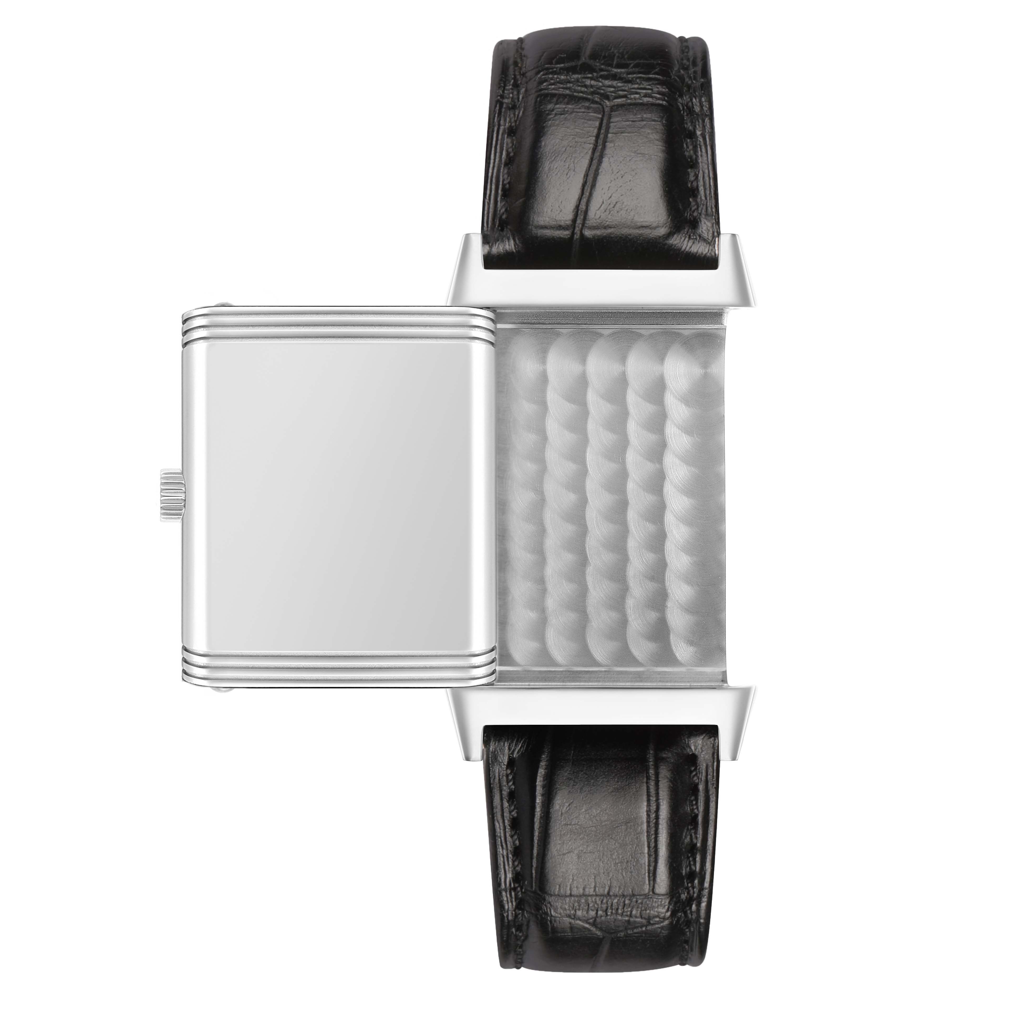 The Jaeger-LeCoultre Reverso watch is shown from a top view, displaying a swivel case and leather strap.