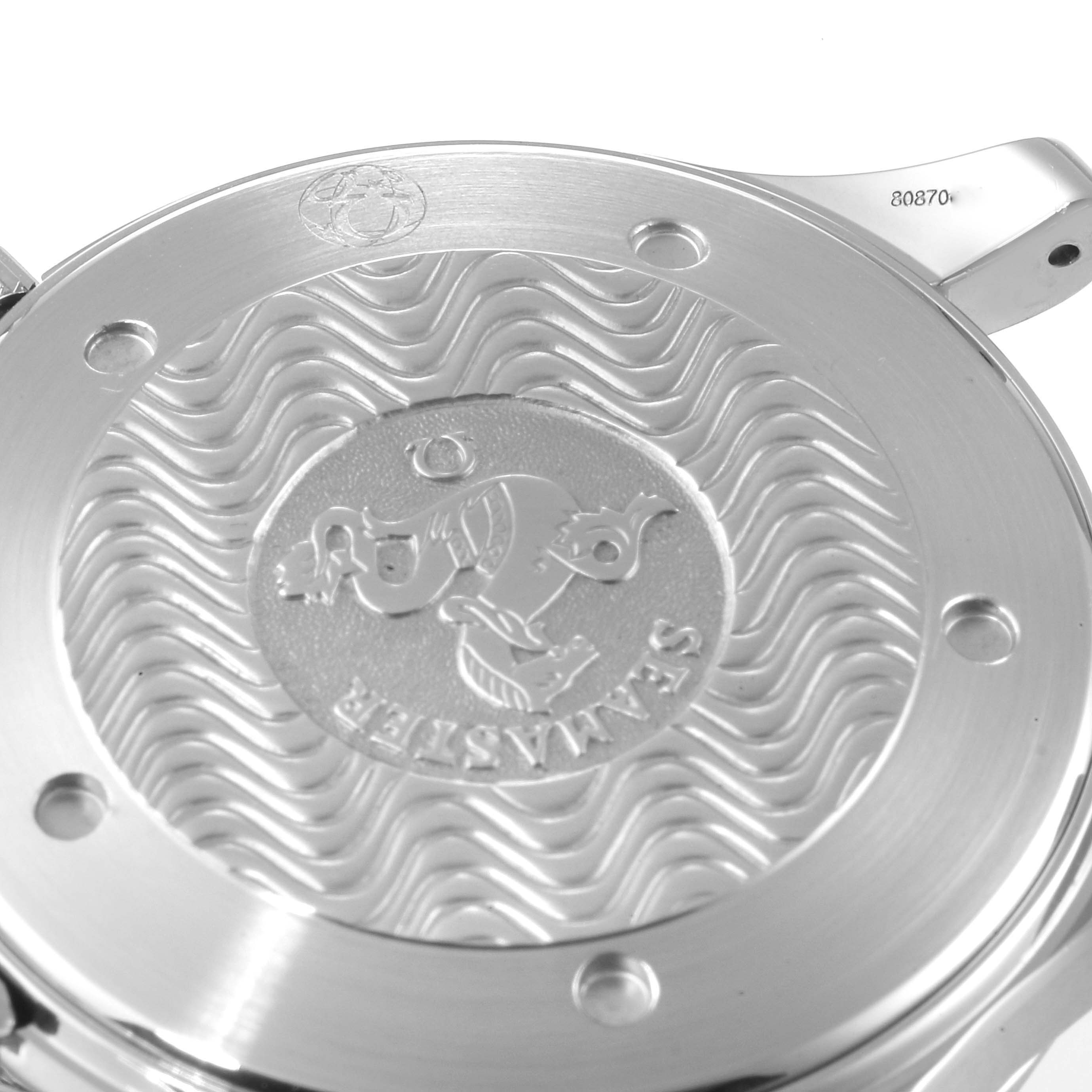 This image shows the back case of an Omega Seamaster 2531.80.00 Men's Stainless Steel Blue Dial 2531.80.00 Men's Stainless Steel Blue Dial watch, featuring a wave pattern and an engraved emblem.