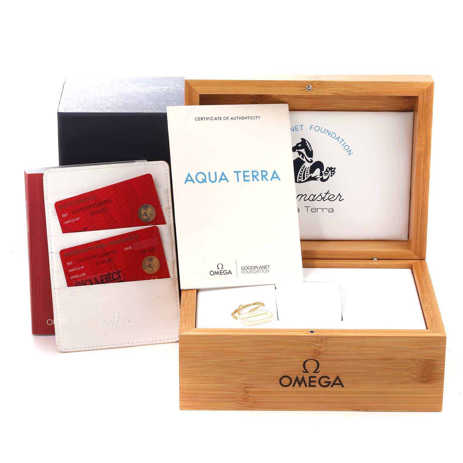 The image shows the packaging and accessories of the Omega Aqua Terra 231.92.39.21.04.001 Men's Titanium White Dial 231.92.39.21.04.001 Men's Titanium White Dial, including the box, authentication card, booklet, and holder.