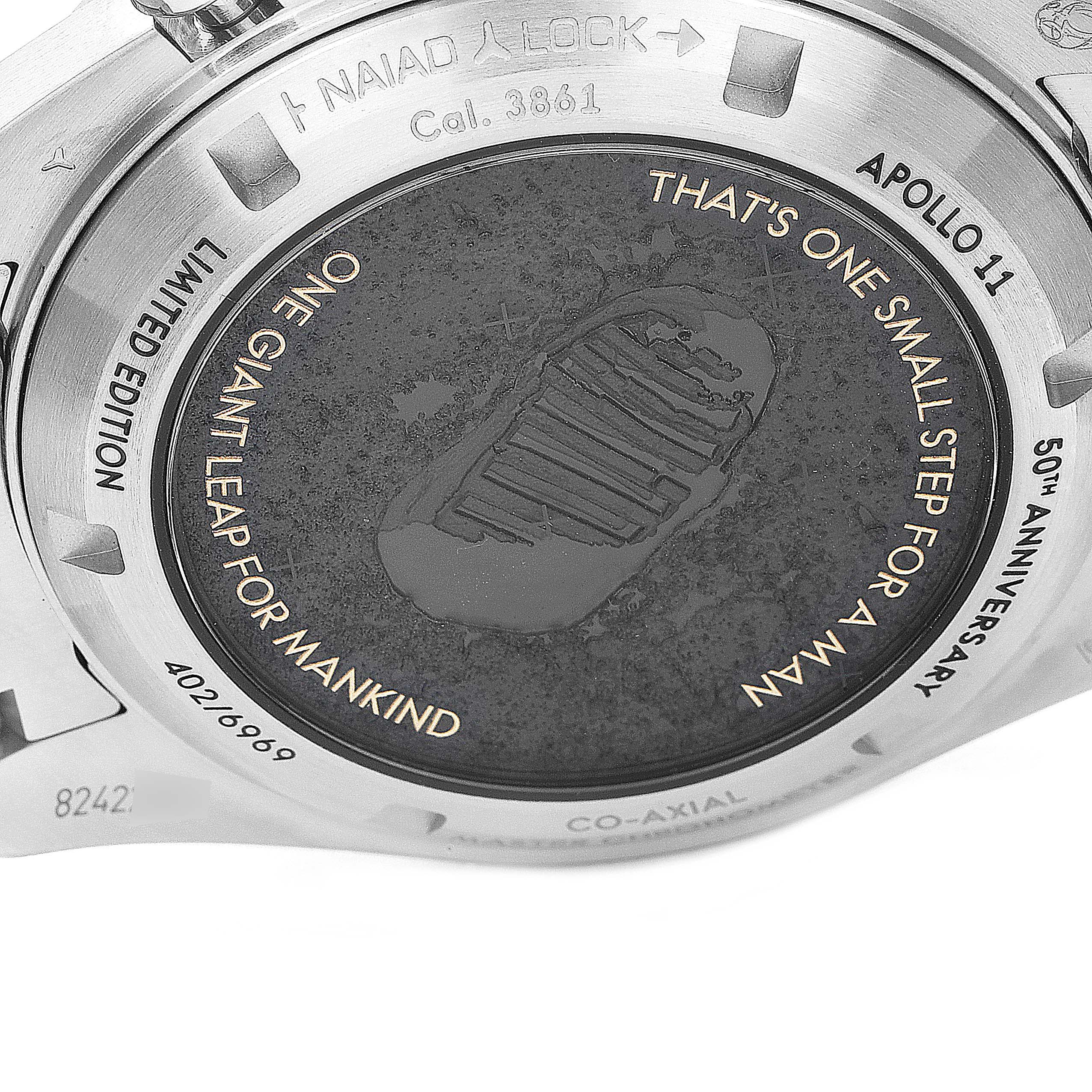 The image shows the engraved case back of the Omega Speedmaster 310.20.42.50.01.001 Men's Stainless Steel Grey Dial 310.20.42.50.01.001 Men's Stainless Steel Grey Dial Apollo 11 50th Anniversary Limited Edition watch.