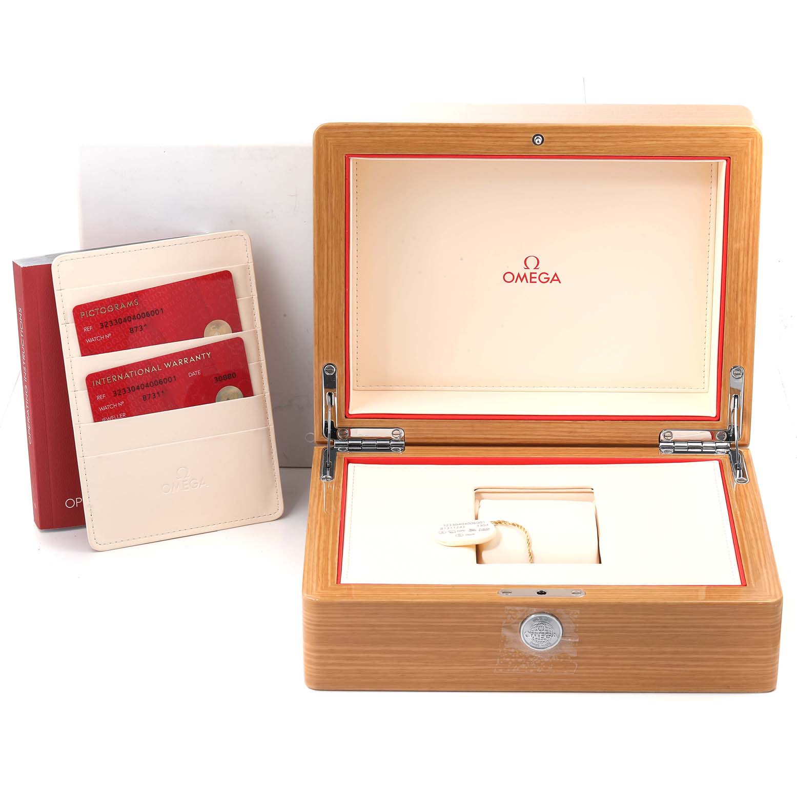 This image shows the open packaging box and warranty cards for the Omega Speedmaster 323.30.40.40.06.001 Men's Stainless Steel Grey Dial 323.30.40.40.06.001 Men's Stainless Steel Grey Dial model.