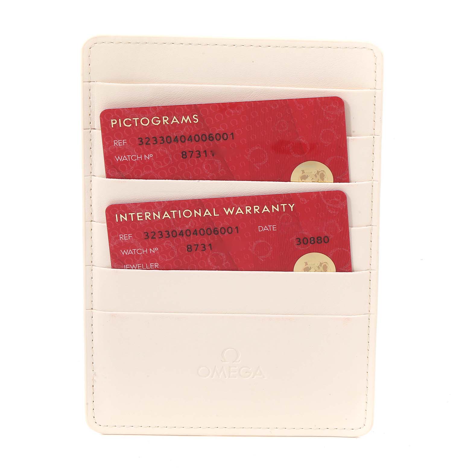 This image shows the international warranty and pictogram cards for an Omega Speedmaster 323.30.40.40.06.001 Men's Stainless Steel Grey Dial 323.30.40.40.06.001 Men's Stainless Steel Grey Dial watch in a white cardholder.