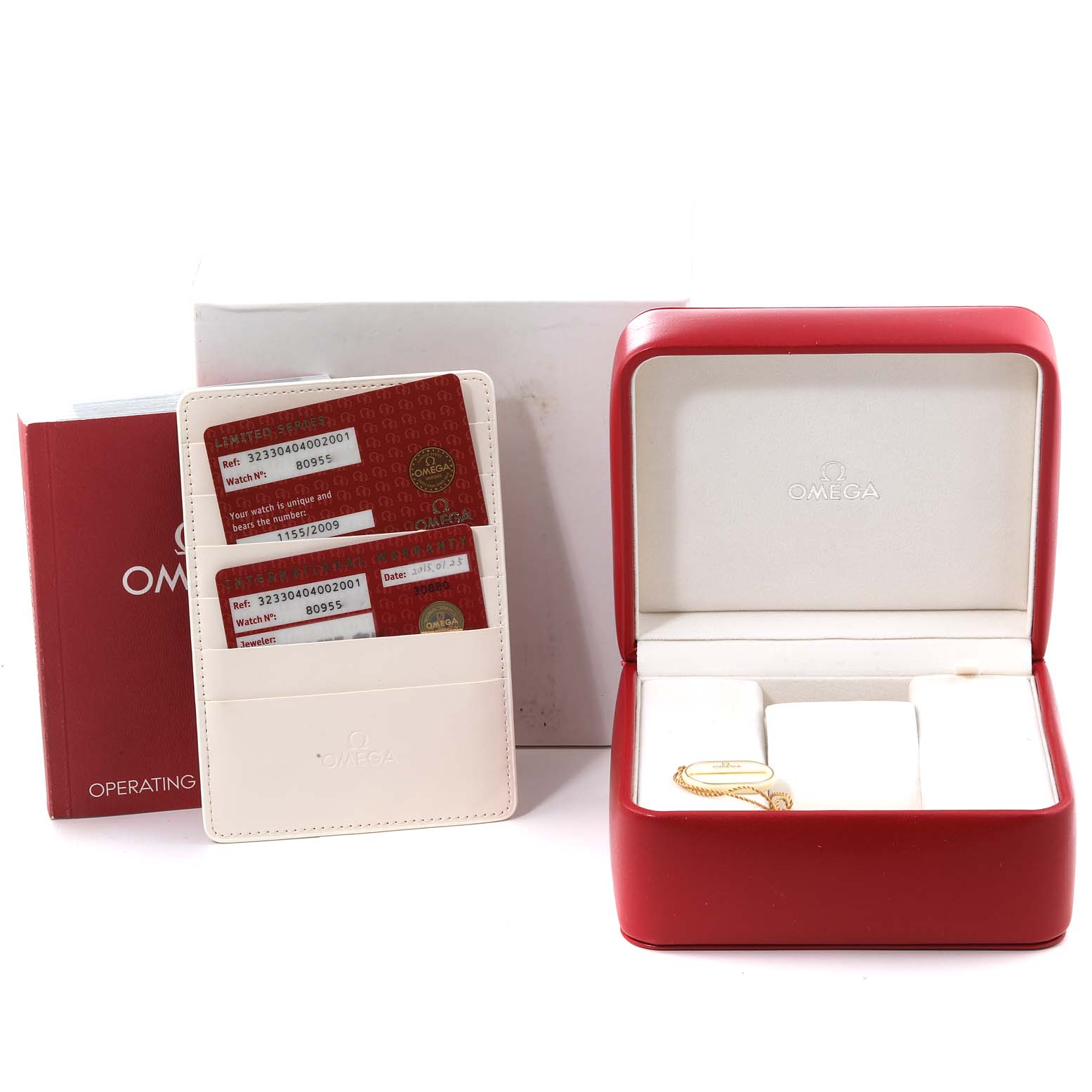 The image shows an Omega Speedmaster 323.30.40.40.02.001 Men's Stainless Steel White Dial 323.30.40.40.02.001 Men's Stainless Steel White Dial watch box, warranty cards, an operating manual, and a cardholder.