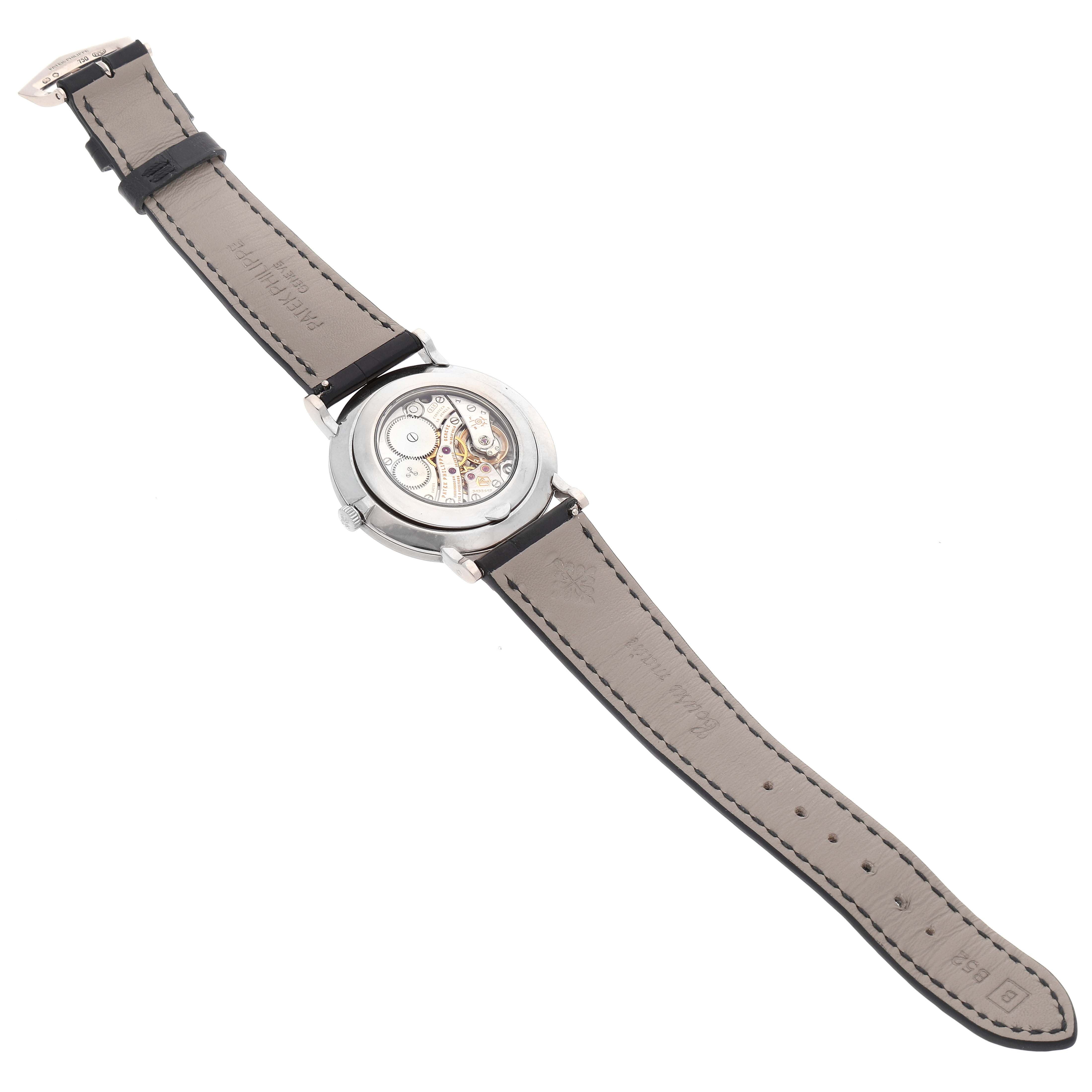 This image shows the back view of a Patek Philippe Calatrava 5119G Men's White Gold White Dial 5119G Men's White Gold White Dial watch, highlighting its leather strap and transparent case back.