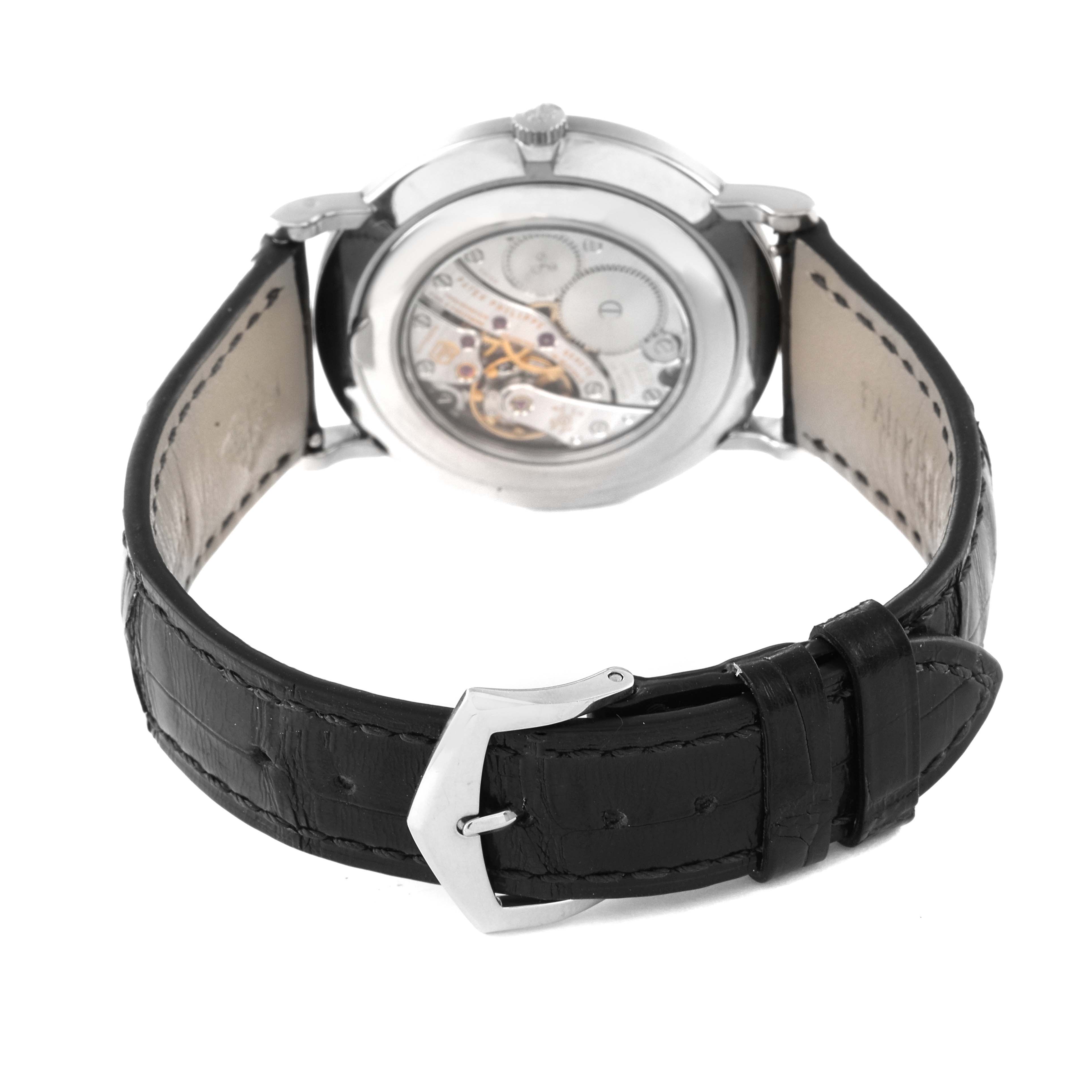 The image shows the back view of a Patek Philippe Calatrava 5119G Men's White Gold White Dial 5119G Men's White Gold White Dial watch, highlighting its movement and buckle.