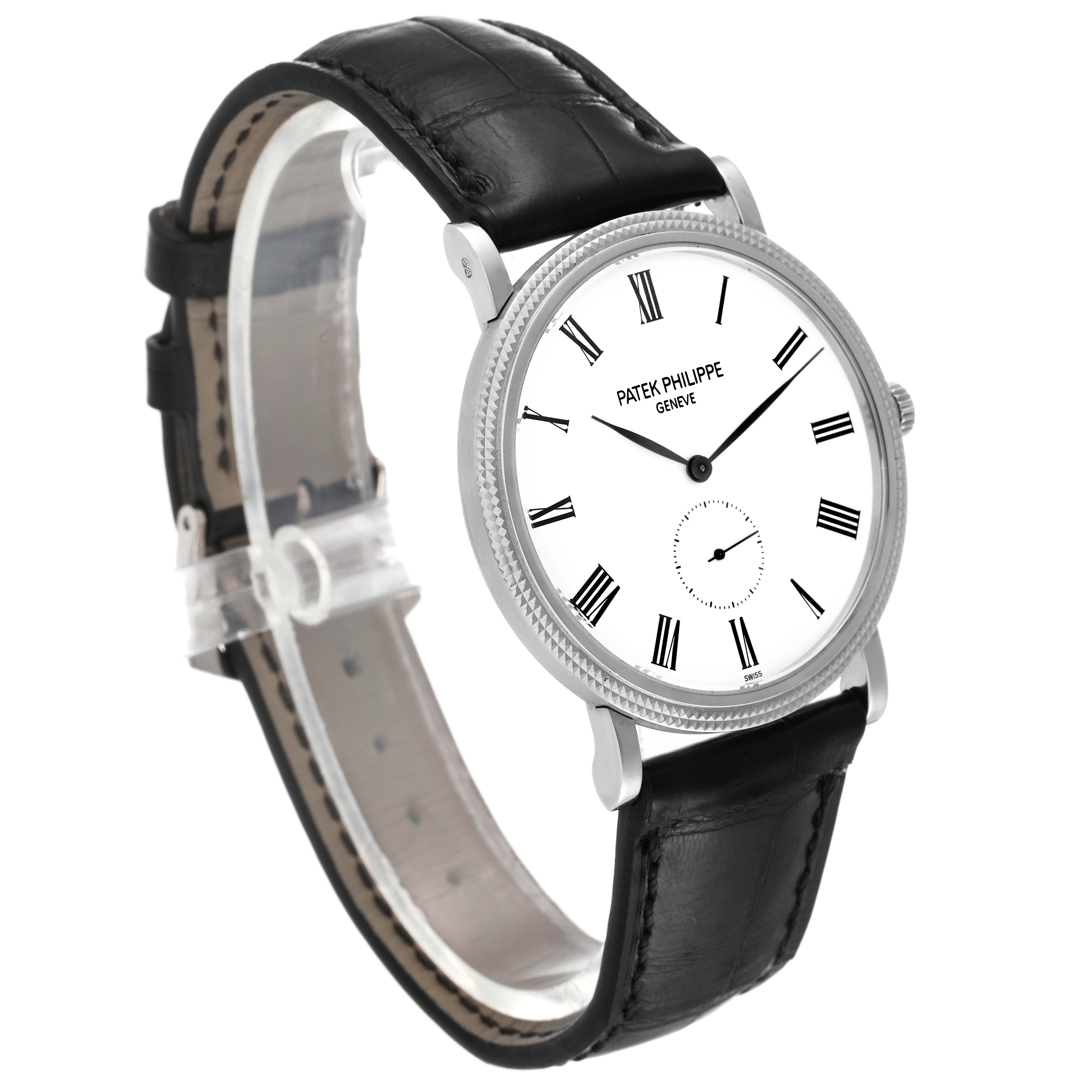 The image shows a side angle of the Patek Philippe Calatrava 5119G Men's White Gold White Dial 5119G Men's White Gold White Dial watch, displaying its face, case, and black leather strap.
