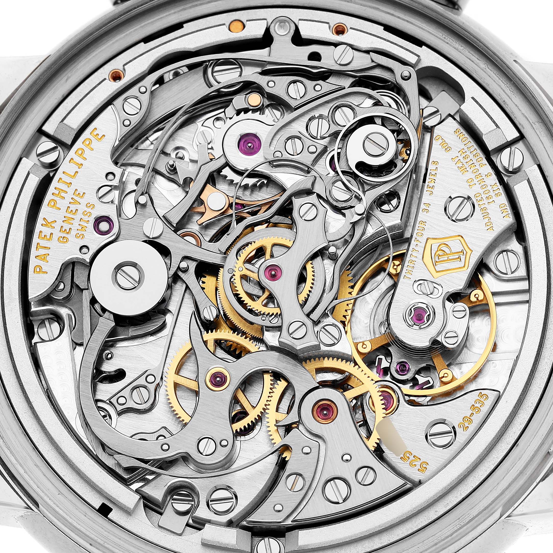 The image shows the intricate movement and internal components of the Patek Philippe Complications 5204G-001 Men's White Gold Green Dial watch from a close-up angle.