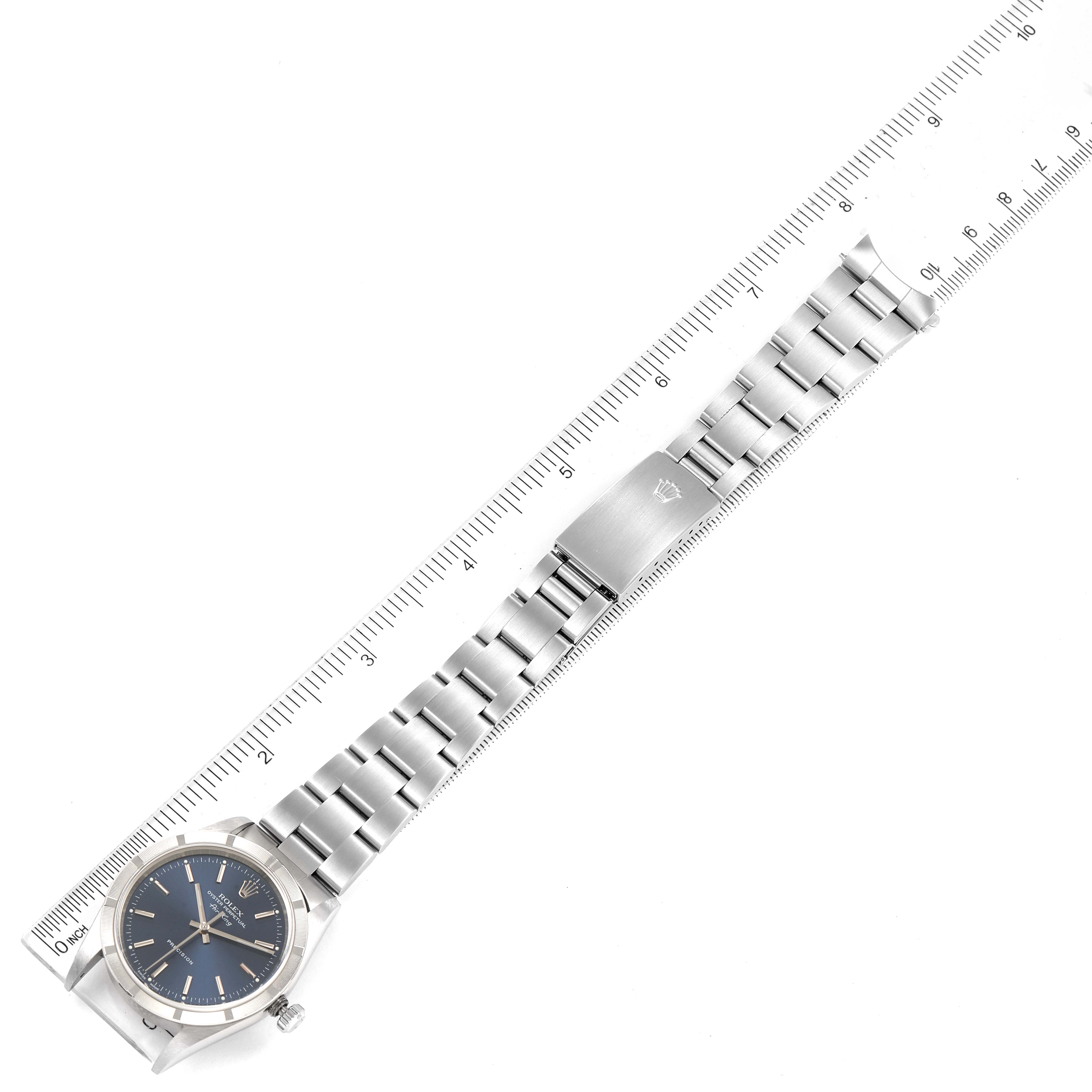 The Rolex Air-King 14010 Men's Stainless Steel Blue Dial 14010 Men's Stainless Steel Blue Dial watch is shown from a top-down angle, displaying the face, strap, and clasp.