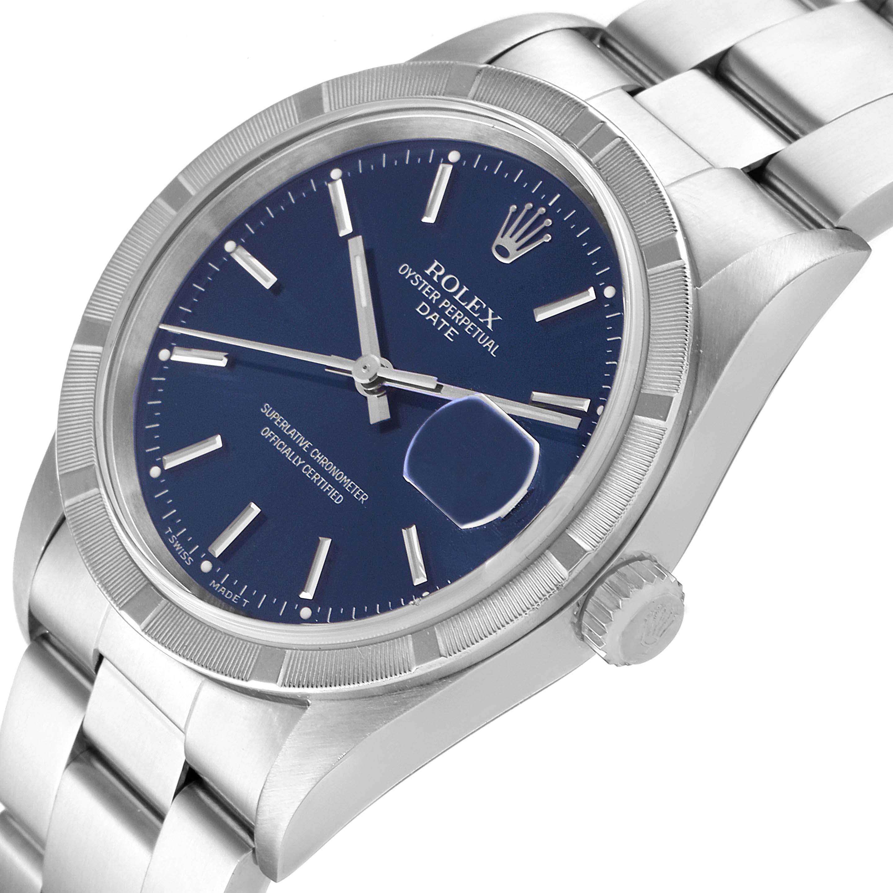 The image shows a Rolex Date 15210 Men's Stainless Steel Blue Dial 15210 Men's Stainless Steel Blue Dial model watch from an angled view, highlighting the blue dial, crown, fluted bezel, and part of the bracelet.