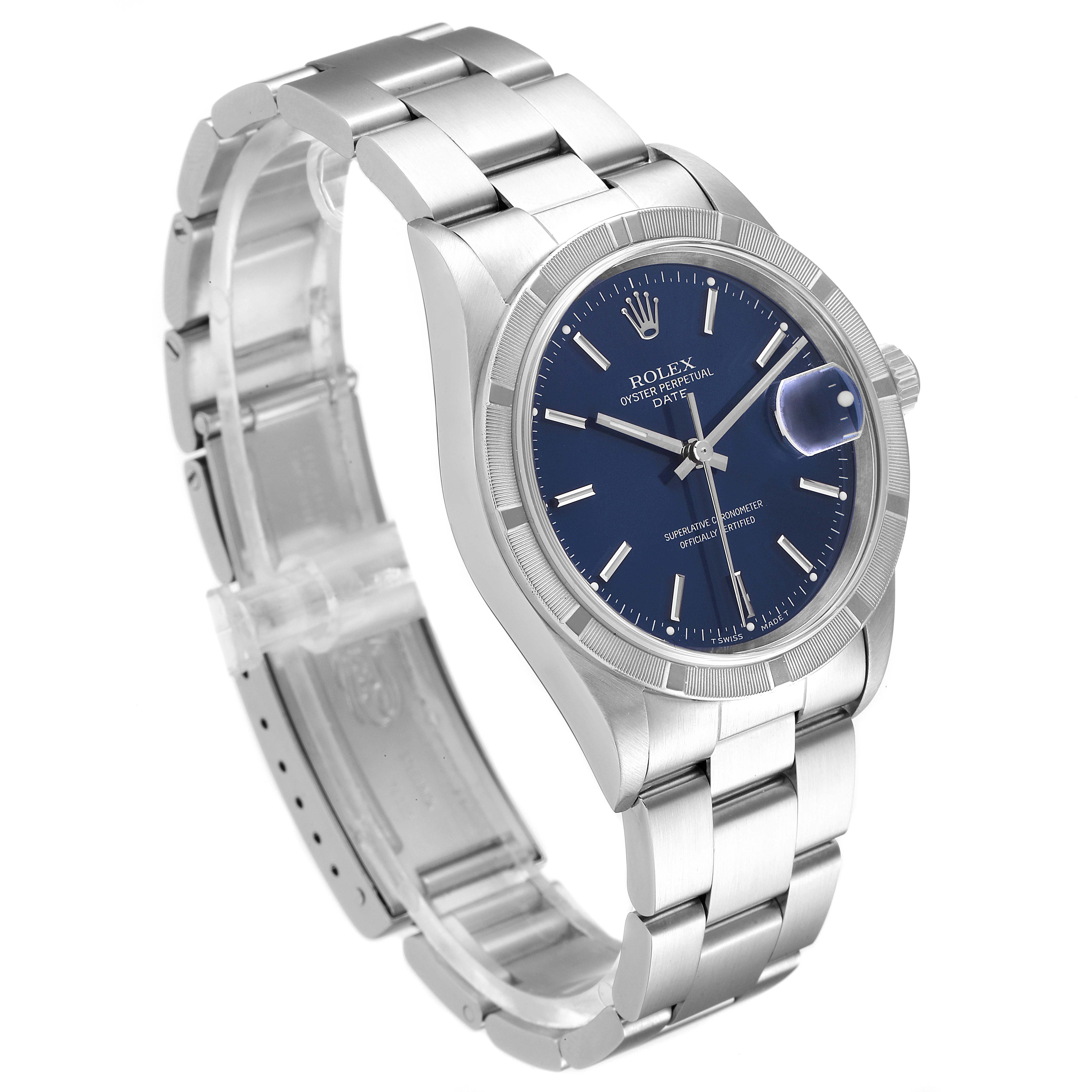 The image shows a Rolex Oyster Perpetual Date watch at an angle, highlighting its blue dial, bezel, and metal bracelet.