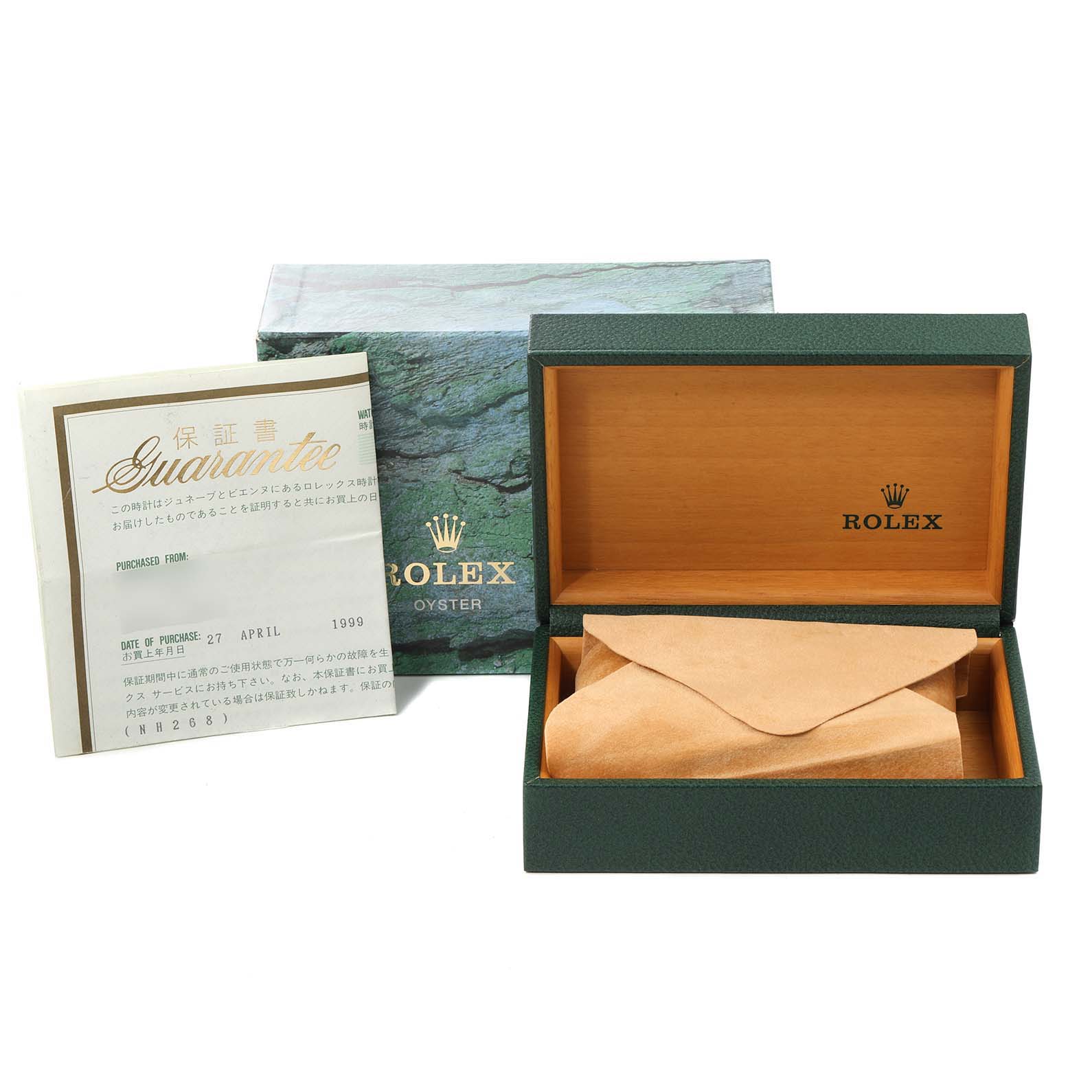 The image shows an open Rolex Date 15210 Men's Stainless Steel Blue Dial 15210 Men's Stainless Steel Blue Dial model box, a green outer box, a guarantee certificate, and a beige pouch.