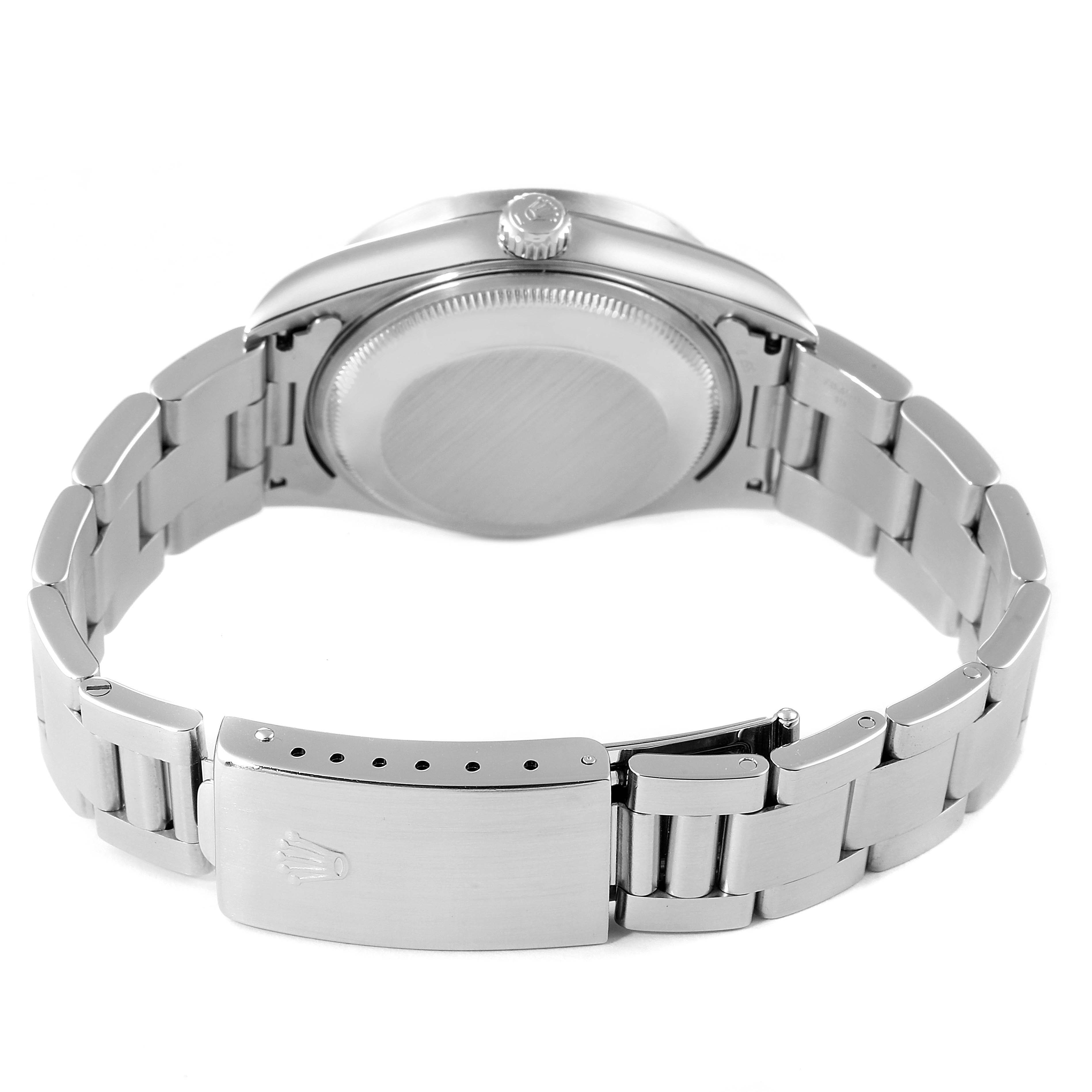 The image shows the back case and bracelet clasp of a Rolex Date 15210 Men's Stainless Steel Blue Dial 15210 Men's Stainless Steel Blue Dial model watch from a rear angle.