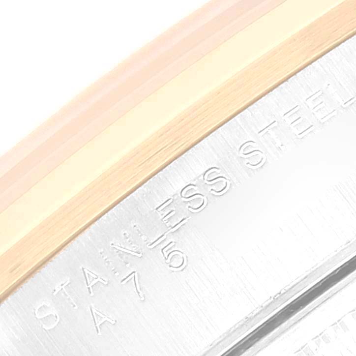 This close-up image shows the side of a Rolex Date 15203 Men
s Steel and Gold (two tone) Silver Dial 15203 Men
s Steel and Gold (two tone) Silver Dial watch case with stainless steel and gold elements visible.