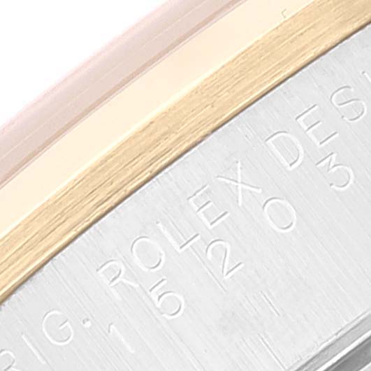 The image shows a close-up of the case edge on a Rolex Date 15203 Men
s Steel and Gold (two tone) Silver Dial 15203 Men
s Steel and Gold (two tone) Silver Dial model, displaying the engraved brand markings.