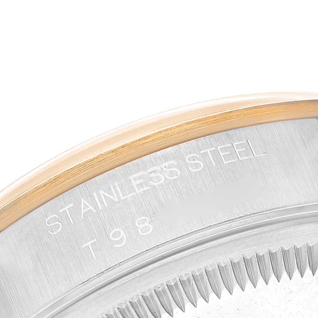 This image shows a close-up side view of the case back of a Rolex Date 15203 Men's Steel and Gold (two tone) White Dial 15203 Men's Steel and Gold (two tone) White Dial model, highlighting the stainless steel material and bezel.