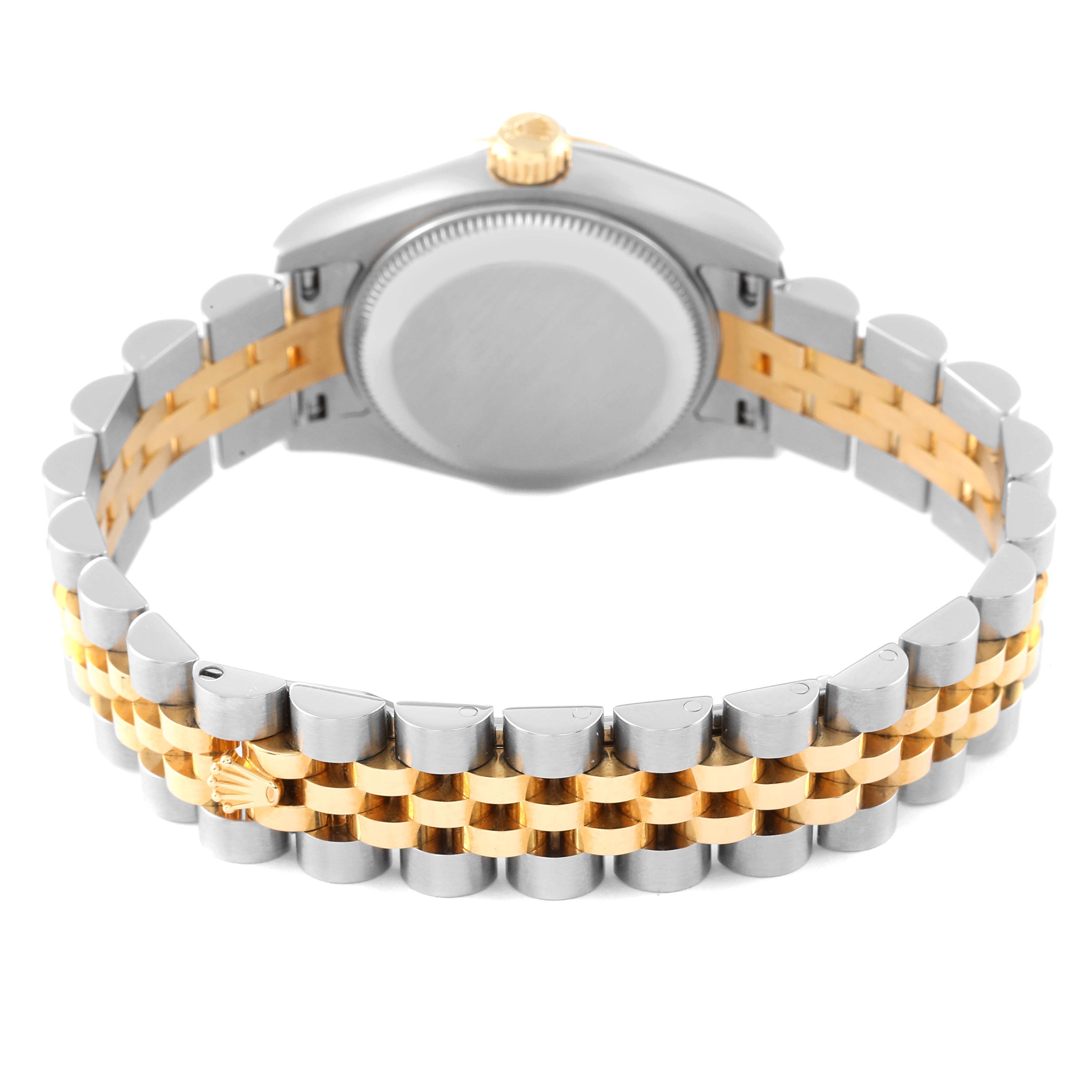 The image shows the back view of a Datejust model by Rolex, highlighting the two-tone bracelet and case back.