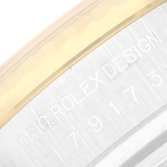 The image shows a close-up of the bezel and engraved design detail on a Rolex Datejust 179173 Women's Steel and Gold (two tone) Silver Dial 179173 Women's Steel and Gold (two tone) Silver Dial watch.