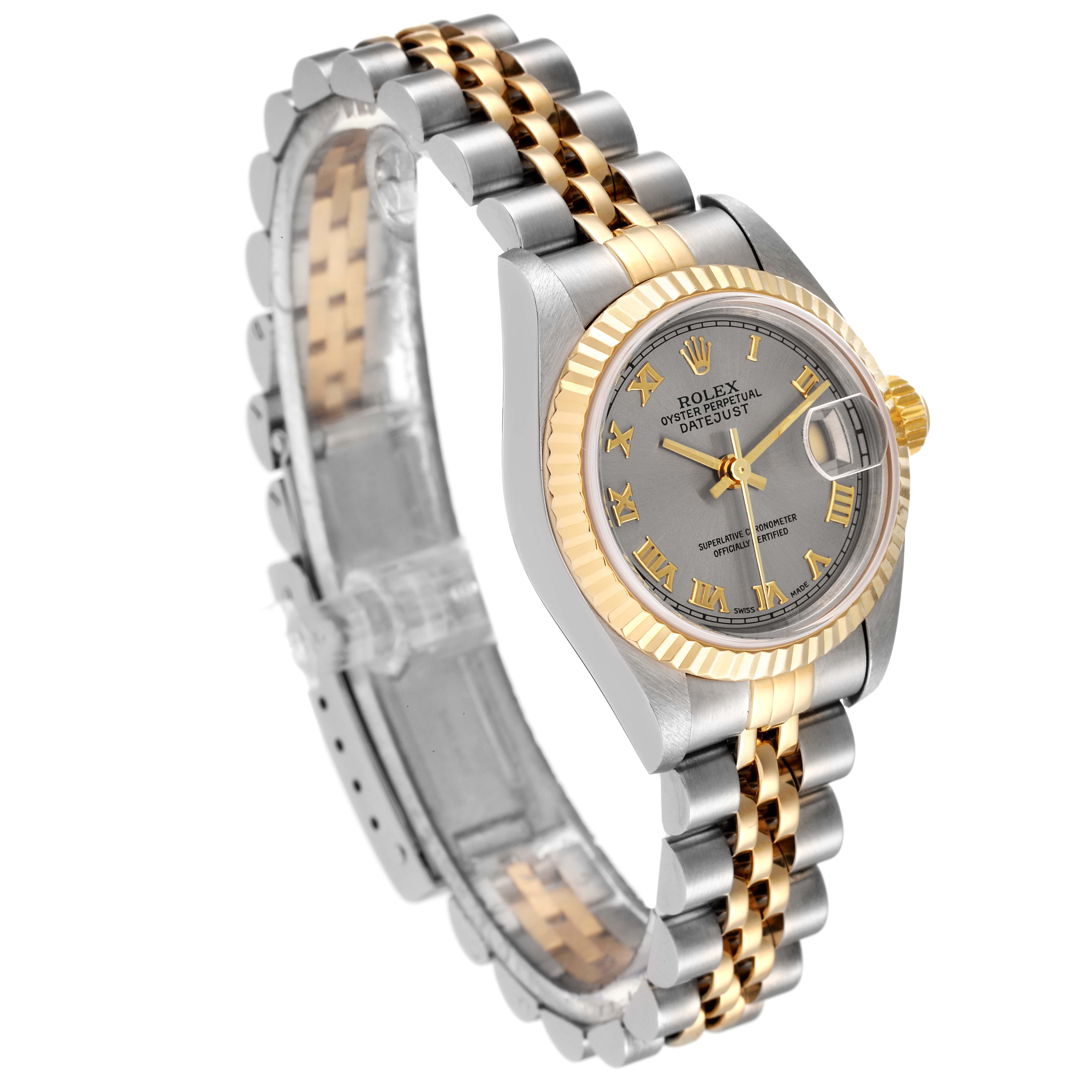 The image shows a Rolex Datejust 79173 Women
s Steel and Gold (two tone) Grey Dial 79173 Women
s Steel and Gold (two tone) Grey Dial watch at a slightly angled top-side view, highlighting its two-tone bracelet, fluted bezel, and grey dial.
