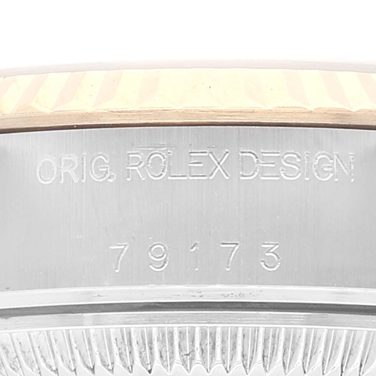 This close-up shows the engraved model number "79173" on the side of the Rolex Datejust 79173 Women's Steel and Gold (two tone) White Dial 79173 Women's Steel and Gold (two tone) White Dial watch case.