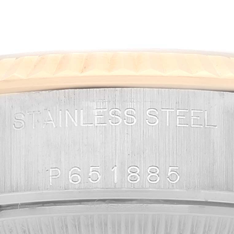The image shows a close-up of the side of a Rolex Datejust 79173 Women's Steel and Gold (two tone) White Dial 79173 Women's Steel and Gold (two tone) White Dial watch, highlighting the stainless steel marking and serial number.