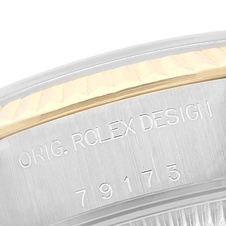 This is a macro view of the case back of a Rolex Datejust 79173 Women's Steel and Gold (two tone) White Dial 79173 Women's Steel and Gold (two tone) White Dial, showing the model number and "ORIG. ROLEX DESIGN" engraving.