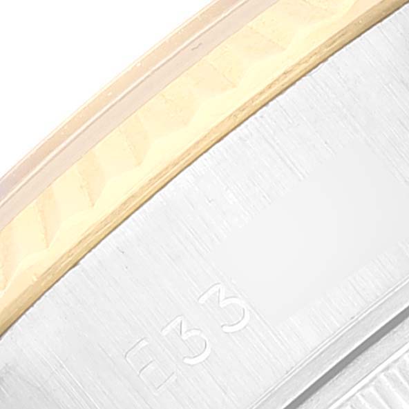 The image shows a close-up of the bezel and part of the case of a Rolex Datejust 69173 Women's Steel and Gold (two tone) Champagne Dial 69173 Women's Steel and Gold (two tone) Champagne Dial watch.