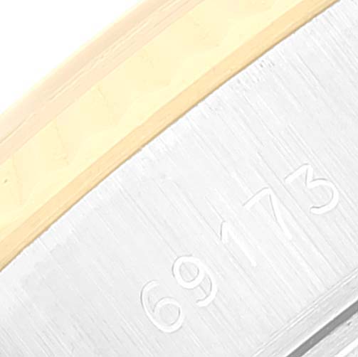This image shows a close-up of the Rolex Datejust 69173 Women's Steel and Gold (two tone) Champagne Dial 69173 Women's Steel and Gold (two tone) Champagne Dial's bracelet with the model number 69173 engraved on it.